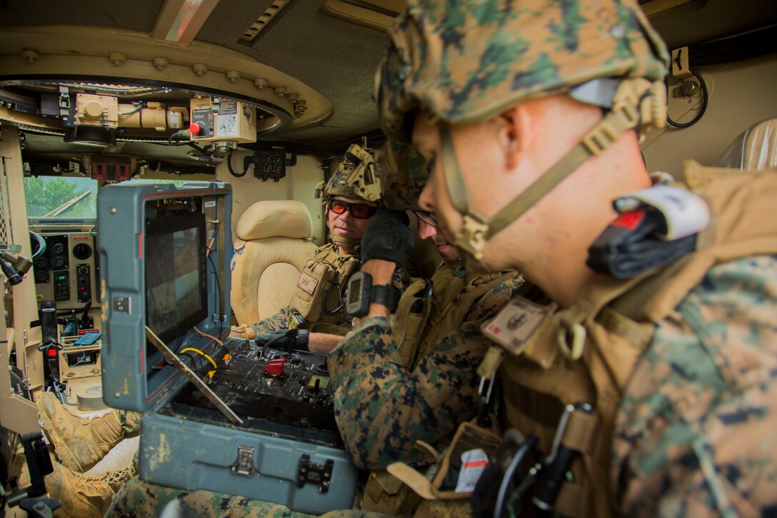 Explosive ordnance disposal technicians with EOD Company, 9th Engineer Support Battalion, 3rd Marine Logistics Group, control a Mark II Talon EOD robot during charge employment training Aug. 2, 2018 at Camp Hansen, Okinawa, Japan. The training taught EOD technicians to effectively neutralize improvised explosive devices with unmanned robotic platforms by safely finding and removing any hazards. (U.S. Marine Corps photo by Lance Cpl. Isabella Ortega)