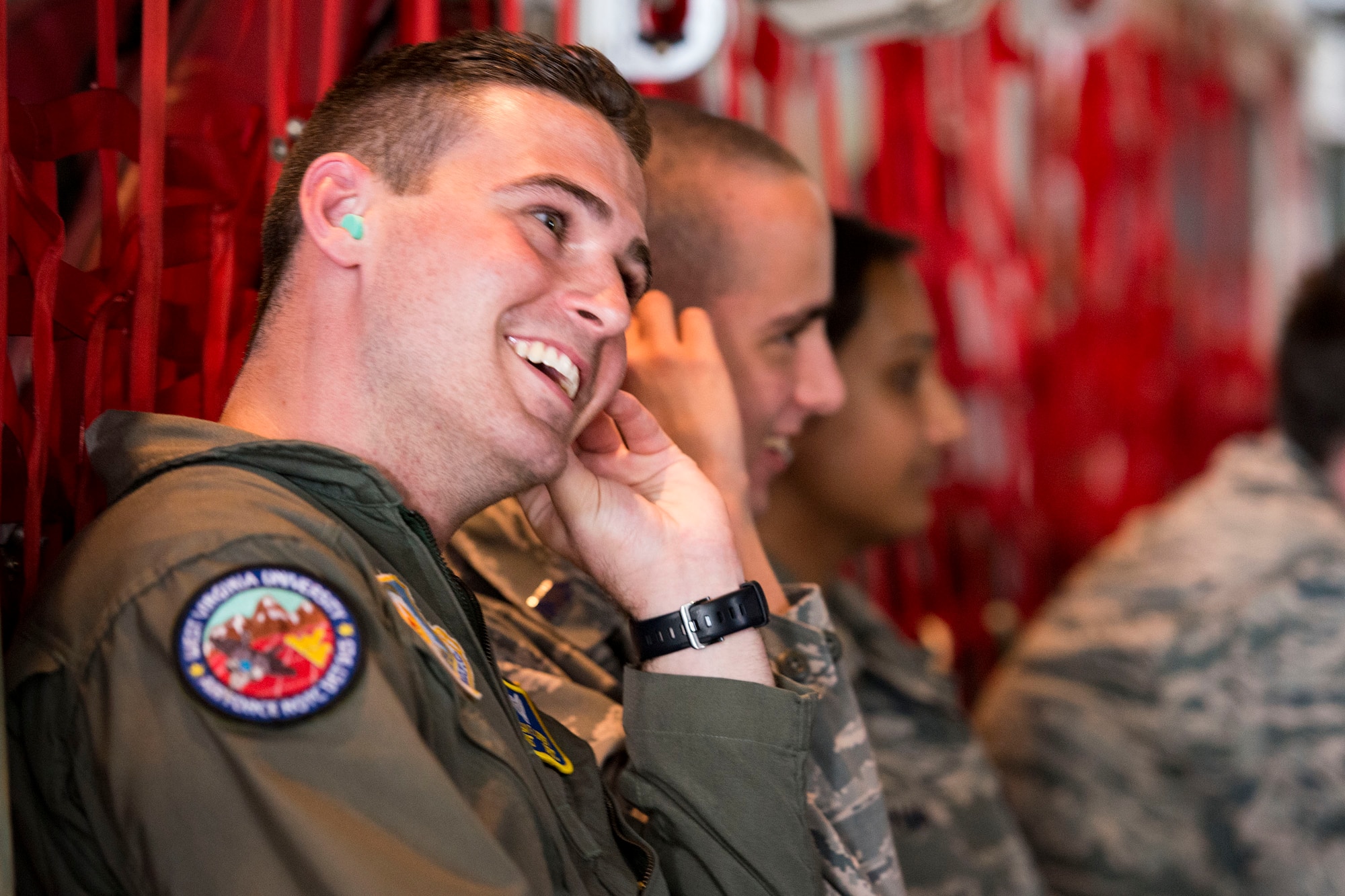 Cadet Logan Lafferty, West Virginia University Detachment 915, adjusts his ear protection while waiting inside an HC-130J Combat King II during Operations Air Force 2018, July 26, 2018, at Moody Air Force Base, Georgia. (U.S. Air Force photo by Airman 1st Class Erick Requadt)