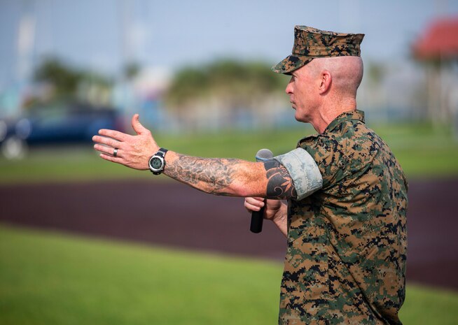 Sgt. Maj. Jason Hammock greets service members and families during a relief and appointment ceremony for Headquarters Regiment, 3rd Marine Logistics Group, Aug. 3, 2018 at Camp Kinser Okinawa, Japan. Sgt. Maj. James E. Monroe ceremoniously transferred accountability and authority of enlisted Marines to Hammock during the ceremony. Monroe is a native of Brewton, Alabama. Hammock is a native of Miami, Florida. (U.S. Marine Corps photo by Cpl. Joshua S. Pinkney)