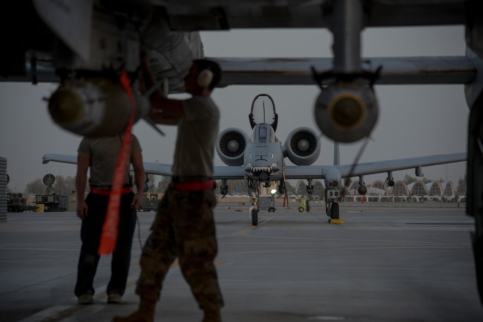 Crew chiefs from the 75th Expeditionary Fighter Squadron conduct pre-flight checks on an A-10C Thunderbolt II before take-off from Kandahar Airfield, Afghanistan, Aug. 2, 2018. The Airmen, from Moody Air Force Base, Georgia, are deployed in support of Operation Freedom's Sentinel by providing close-air support to Afghan forces and other coalition partners. The Thunderbolt II can employ a wide variety of conventional munitions, including general purpose bombs, cluster bomb units, laser guided bombs, joint direct attack munitions or JDAM, wind corrected munitions dispenser or WCMD, AGM-65 Maverick and AIM-9 Sidewinder missiles, rockets, illumination flares and the GAU-8/A 30mm cannon, capable of firing 3,900 rounds per minute. (U.S. Air Force photo by Staff Sgt. Kristin High)