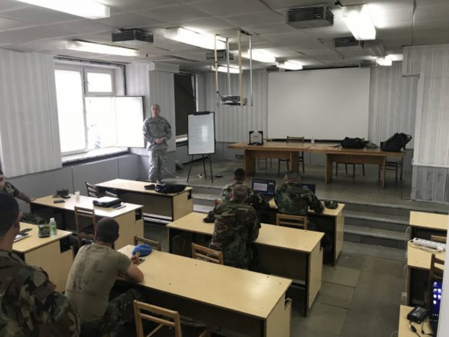 Chief Warrant Officer 4 Donald Champion from the North Carolina National Guard's Joint Force Headquarters briefs members of the Moldovan army Communications Staff during a cyber exercise in Chisinau, Moldova, on July 19, 2018. The event is part of the National Guard's State Partnership Program, established by the Department of Defense. Moldova is a small eastern European country between Ukraine and Romania and has been partners with the NCNG for 22 years.