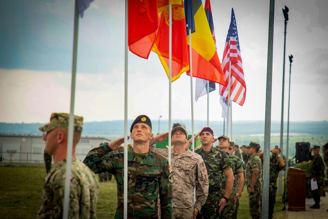 Military service members from eight different Allied and partner nations, including U.S. Marines from Black Sea Rotational Force 18.1, participate in the opening ceremonies for Exercise Platinum Lion 18 at Novo Selo Training Area, Bulgaria, July 30, 2018. Platinum Lion is an annual field training exercise that reinforces relationships in a joint training environment, builds understanding of partner nation tactics, techniques and procedures, and increases interoperability with Allied and partner forces.