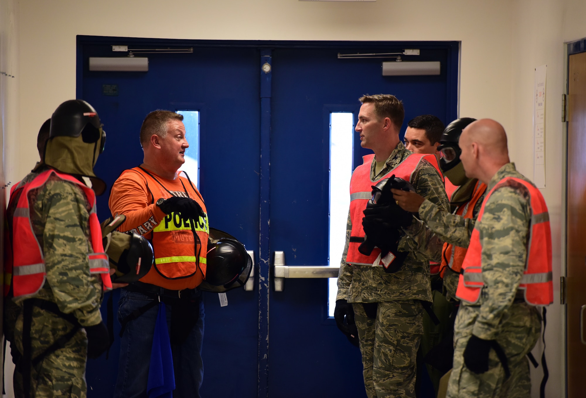 U.S. Air Force senior leadership from the 325th Fighter Wing receive a safety briefing prior to the start of a 325th Security Forces Squadron active -shooter training exercise at Tyndall Elementary School outside of Tyndall Air Force Base, Florida, July 31, 2018. The exercise was developed to help train Tyndall defenders to perform proficiently during real world contingency operations. The squadron provides force protection programs to include weapon system security, police services, resource protection and antiterrorism for a 29,000-acre base with 128 miles of shoreline in support of 325th FW and 30 associate units. (U.S. Air Force photo by Senior Airman Isaiah J. Soliz)