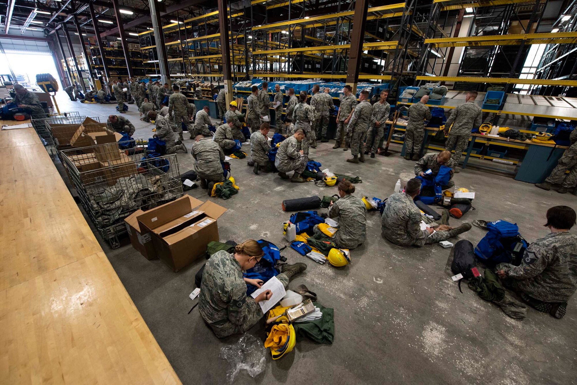 Airmen from the 141st Air Refueling Wing prepare their emergency response and fire equipment bags during a statewide activation of Air and Army National Guard personnel in support of firefighting efforts in eastern Washington August 1, 2018. Gov. Jay Inslee activated National Guard personnel to assist in firefighting efforts throughout the region.  (U.S. Air National Guard photo by Staff Sgt. Rose M. Lust)