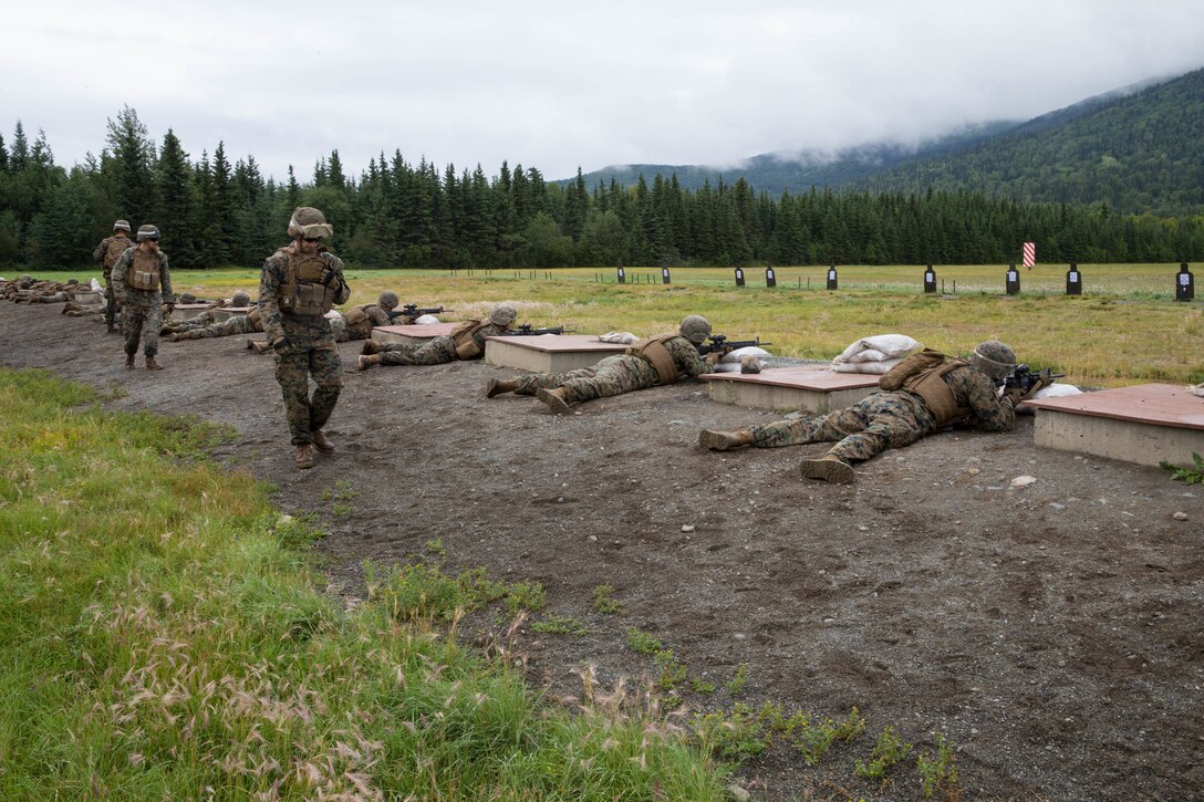Marines competing in the 4th Marine Division Annual Rifle Squad Competition, zero in their rifles at the 25-yard-line, Joint Base Elmendorf-Richardson, Anchorage, Alaska, August 1, 2018. Super Squad Competitions were designed to evaluate a 14-man infantry squad throughout an extensive field and live-fire evolution. (U.S. Marine Corps photo by Lance Cpl. Samantha Schwoch/released)