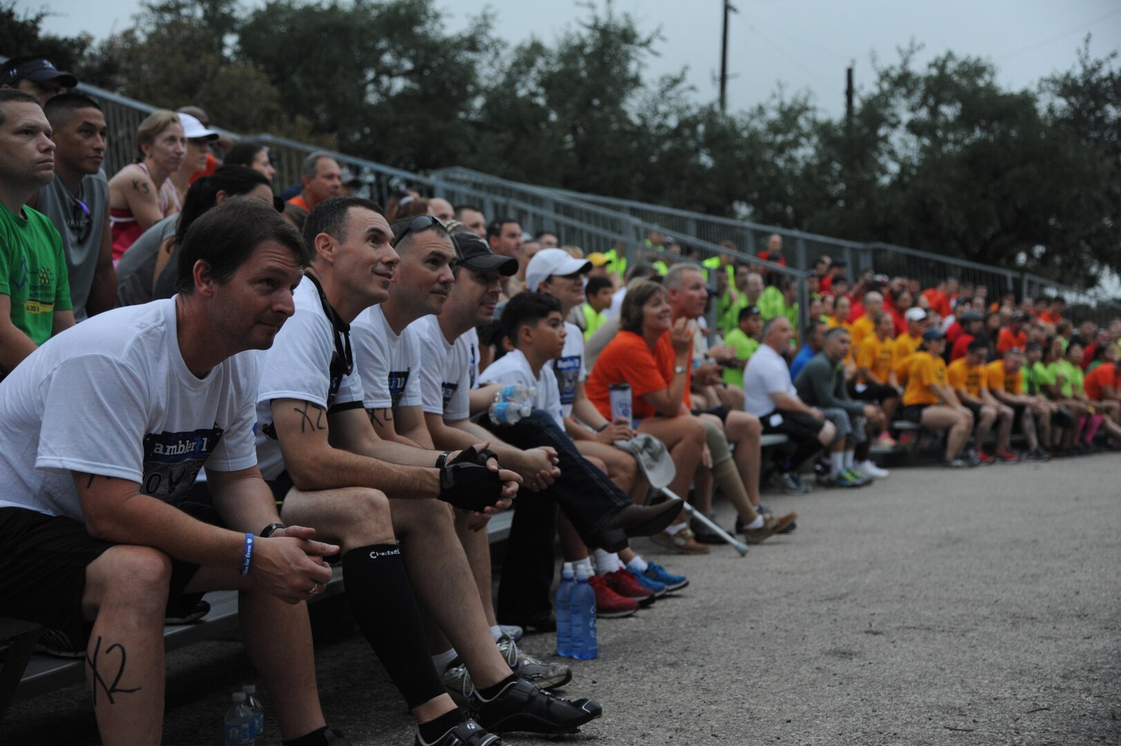 Competitors at the Rambler 120 gather for a safety briefing before the start of the race Sept. 20, 2014, at Joint Base San Antonio Recreation Park at Canyon Lake. The race included a 22-mile bike ride, 10-mile run and 2-mile raft event.