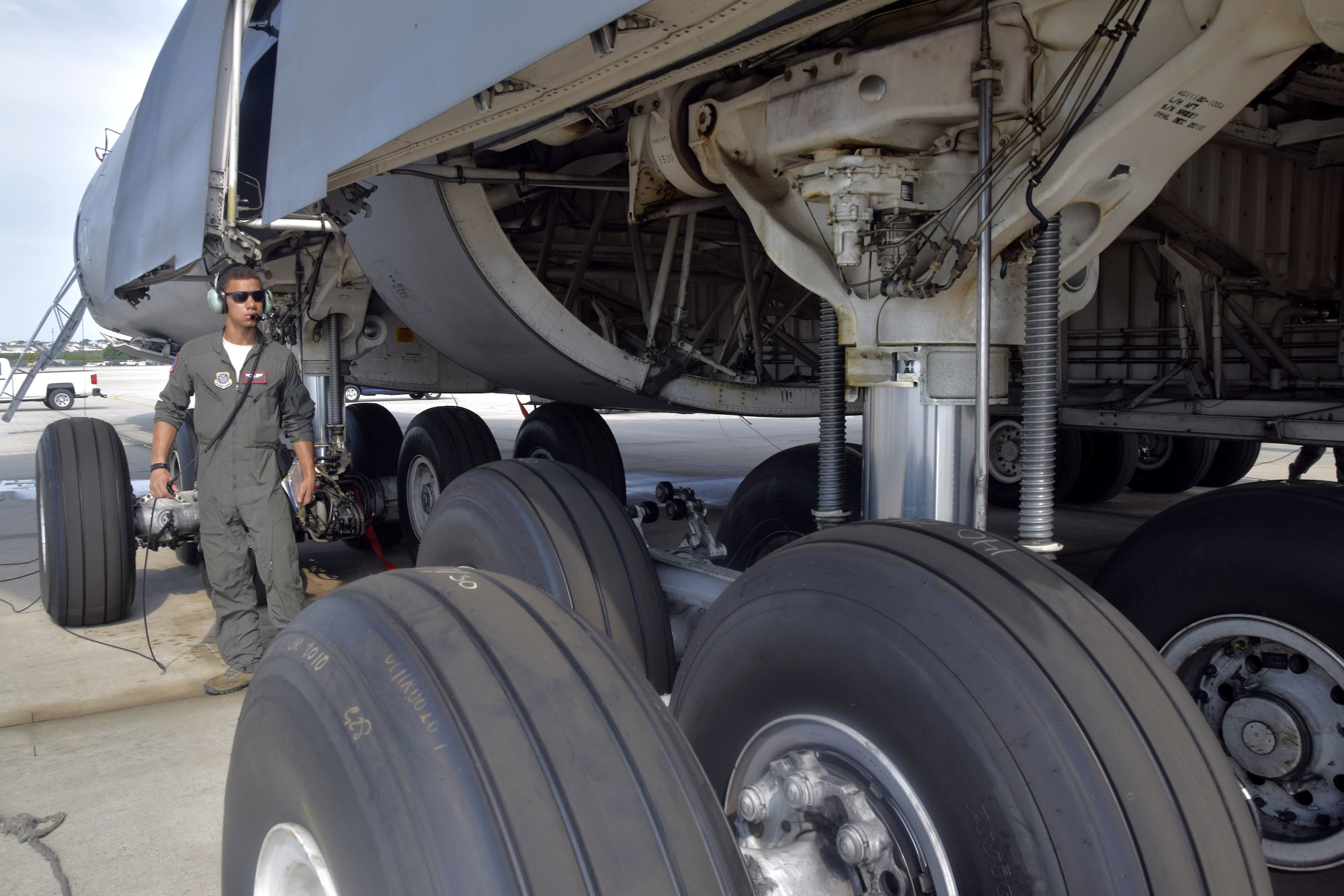 U.S. Air Force Airman Joseph Mitchell, 733rd Training Squadron loadmaster student, conducts a preflight check after loading the C-5M Super Galaxy aircraft with multiple vehicles during a training exercise at Joint Base San Antonio-Lackland, Texas, Aug. 2, 2018.