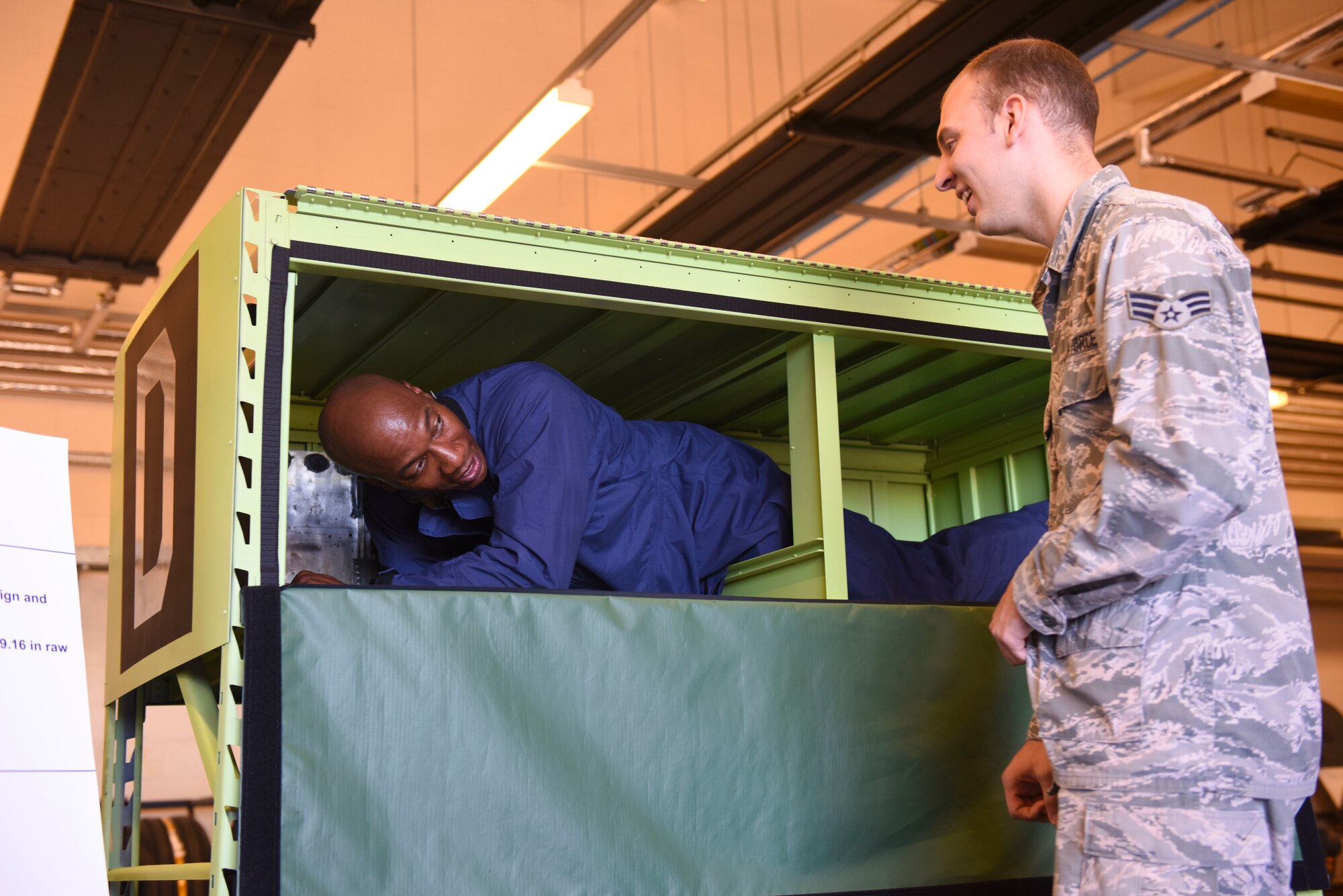 Chief Master Sgt. of the Air Force Kaleth O. Wright climbs into a fuel cell maintenance trainer during his visit to RAF Mildenhall, England, Aug. 2, 2018. Wright also took part in a 100th Security Forces Squadron shoot-house demonstration, participated in a Forward Area Refueling Point exercise, and spoke to RAF Mildenhall Airmen at an all-call during his visit to RAF Mildenhall. (U.S. Air Force photo by Senior Airman Luke Milano)