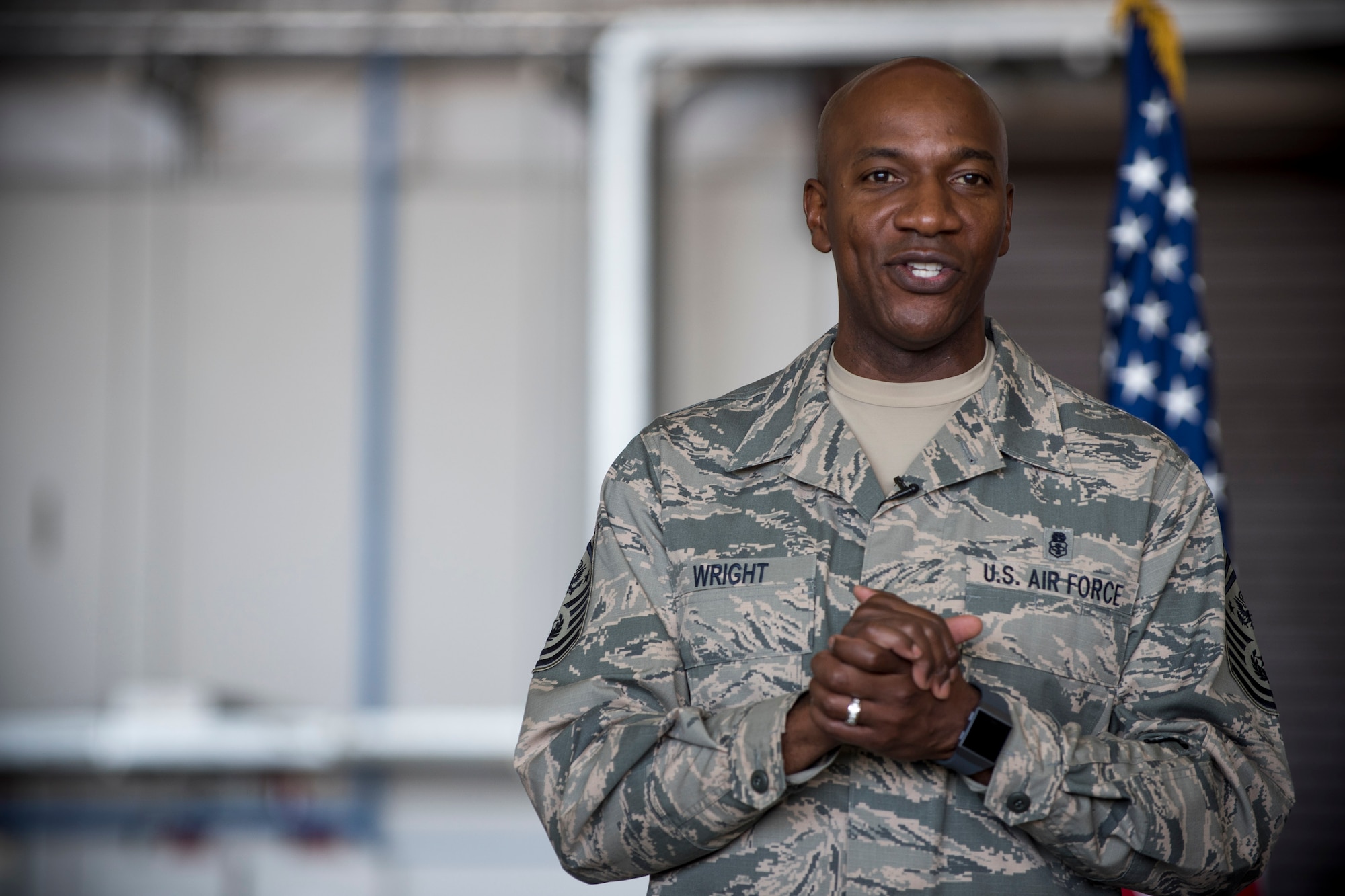 Chief Master Sgt. of the Air Force Kaleth O. Wright speaks to Team Mildenhall Airmen during an all call, at RAF Mildenhall, England, Aug. 2, 2018. Wright also visited multiple units on base to engage U.S. Air Force Airmen about resiliency, leadership and readiness.  (U.S. Air Force photo by Senior Airman Christine Groening)