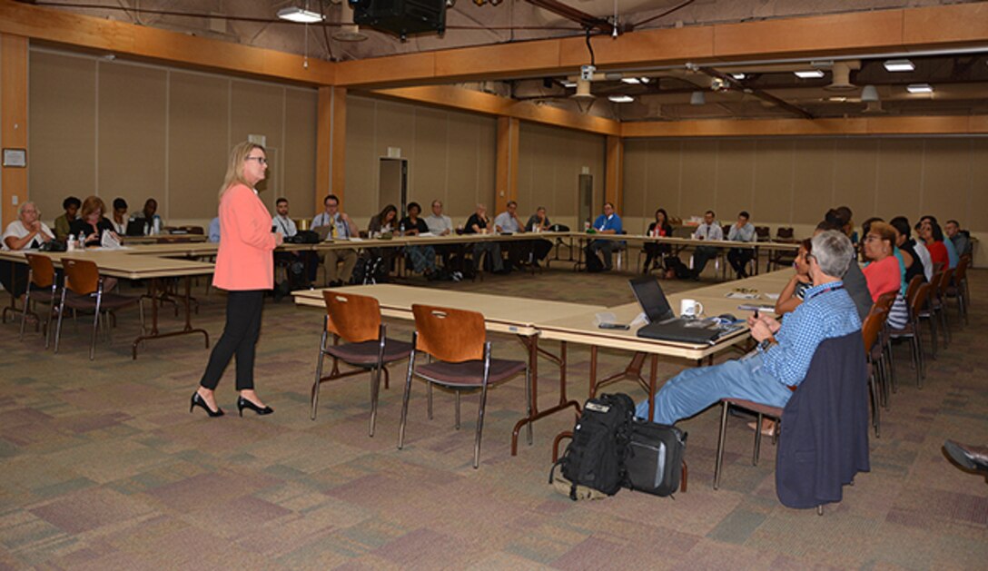 Cathy Contreras greets summit attendees