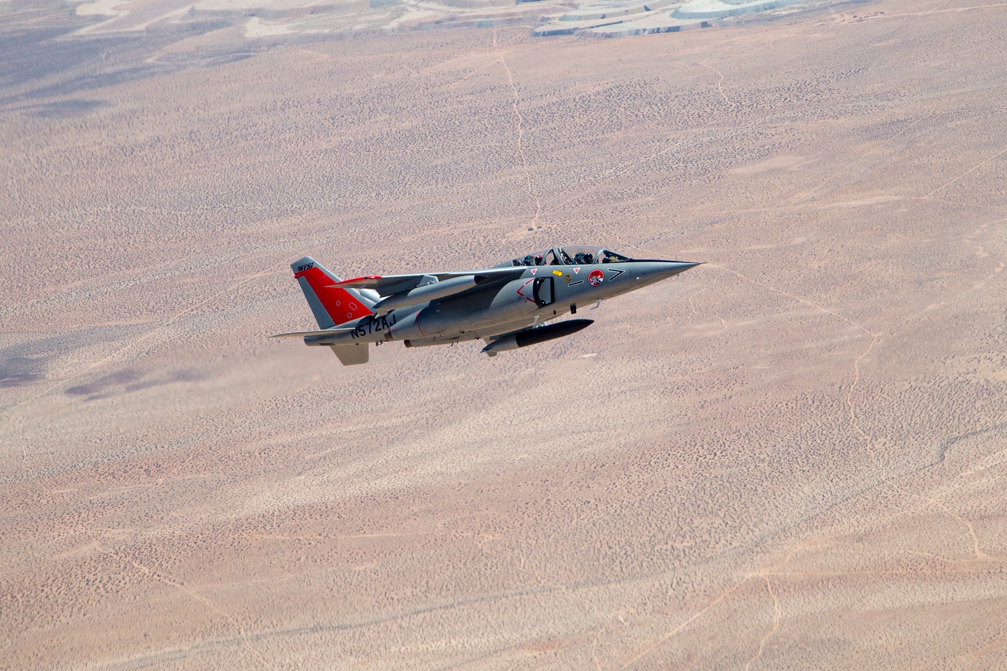 A Gauntlet Aerospace Alpha Jet flies above the Mojave Desert earlier this year. Two Alpha Jets have been contracted to serve as chase aircraft for test missions at Edwards. The 412th Operations Group is conducting an experiment to determine if the planes can successfully provide needed test support. (U.S. Air Force photo by Ethan Wagner)