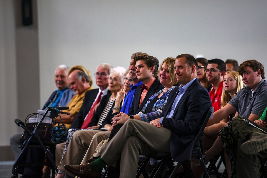 Loved ones look on as Col. Jay Vietas relinquished command to Col. Tiffany Morgan during the 23d Medical Group change of command ceremony, Aug. 3, 2018, at Moody Air Force Base, Ga. Morgan commands the 23d MDG, who provides outpatient medical, dental, occupational, environmental and preventive healthcare services in support of two combat ready wings. (U.S. Air Force photo by Senior Airman Greg Nash)