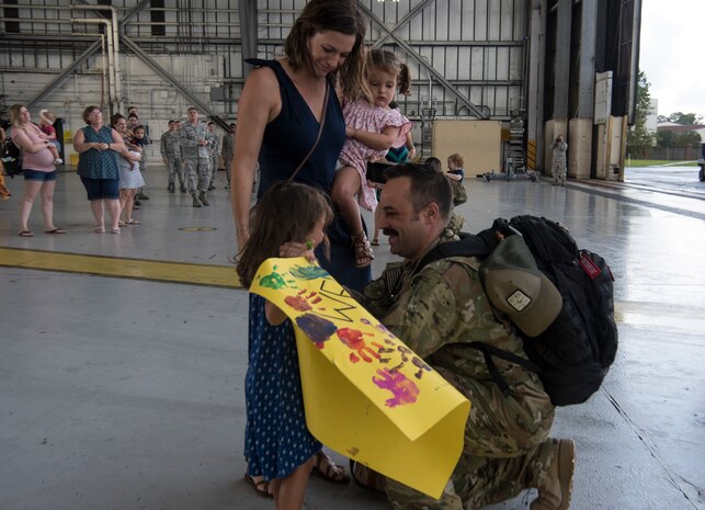 Maj. Ben Buxton, 16th Airlift Squadron assistant director of operations, is reunited with his family August 2, 2018, at Joint Base Charleston S.C.