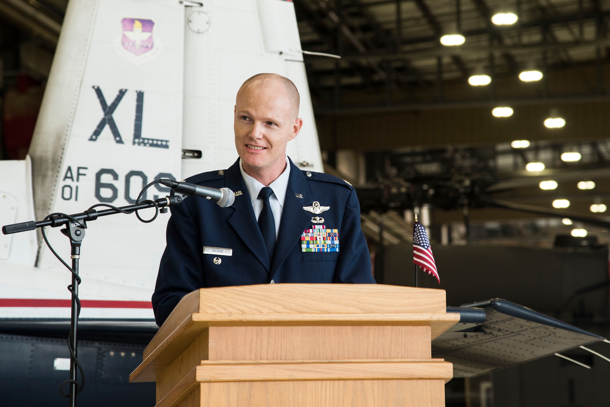 U.S. Air Force Lt. Col. Robert Vicars, Pilot Training Next lead speaks during the first ever Pilot Training Next graduation August 3, 2018 at the Texas Army National Guard Hangar in Austin, Texas. PTN is a program to explore and potentially prototype a training environment that integrates various technologies to produce pilots in an accelerated, cost efficient, learning-focused manner.(U.S. Air Force photo by Senior Airman Gwendalyn Smith)