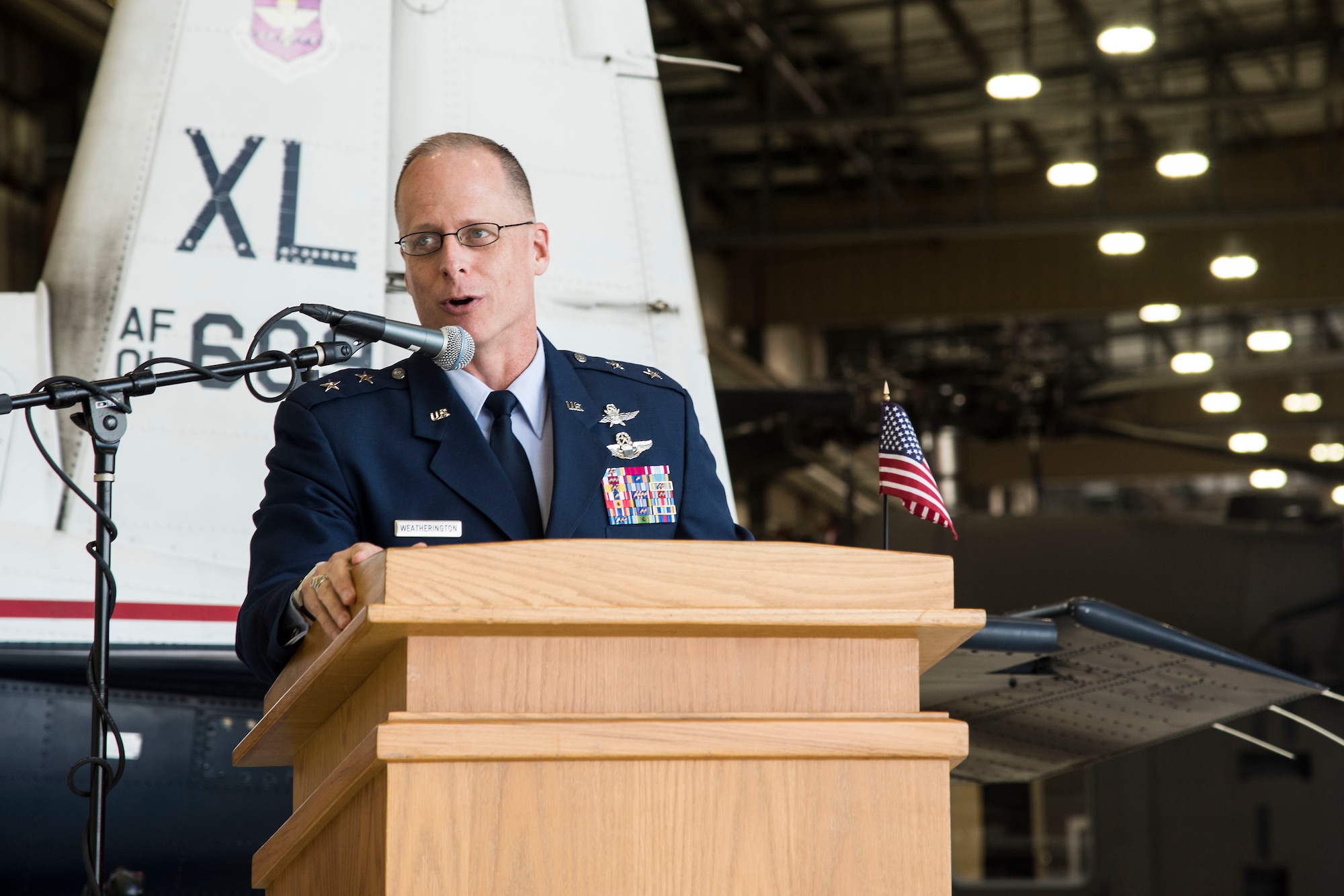 U.S. Air Force Maj. General Mark Weatherington, Air Education and Training deputy commander speaks during the first ever Pilot Training Next graduation August 3, 2018 at the Texas Army National Guard Hangar in Austin, Texas. PTN is a program to explore and potentially prototype a training environment that integrates various technologies to produce pilots in an accelerated, cost efficient, learning-focused manner.(U.S. Air Force photo by Senior Airman Gwendalyn Smith)