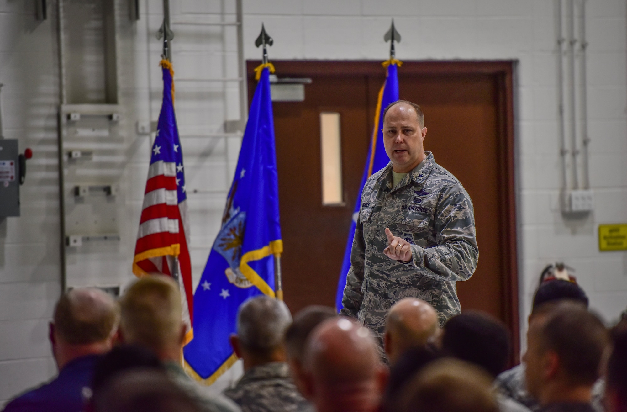 Brig. Gen. John J. Nichols, 509th Bomb Wing commander, addresses Airmen during a safety stand-down all call July 27, 2018, at Whiteman Air Force Base, Mo. After three years of zero reportable motorcycle incidents, base leaders cautioned members to review safety regulations and apply sound decision making in the wake of of a recent spike in rider mishaps. Nichols announced a comprehensive review of safety protocol and launch of a new rider mentorship program. (U.S. Air force photo by Tech. Sgt. Alexander W. Riedel)