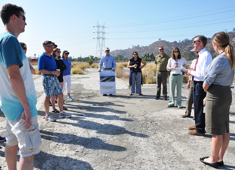 Gary Lee Moore, Los Angeles city engineer, second from right, talks to students and instructors with the U.S. Army Corps of Engineers Planning Associates Program about plans for ecosystem restoration along the Los Angeles River during the group's July 25 bus tour of Los Angeles County watersheds.