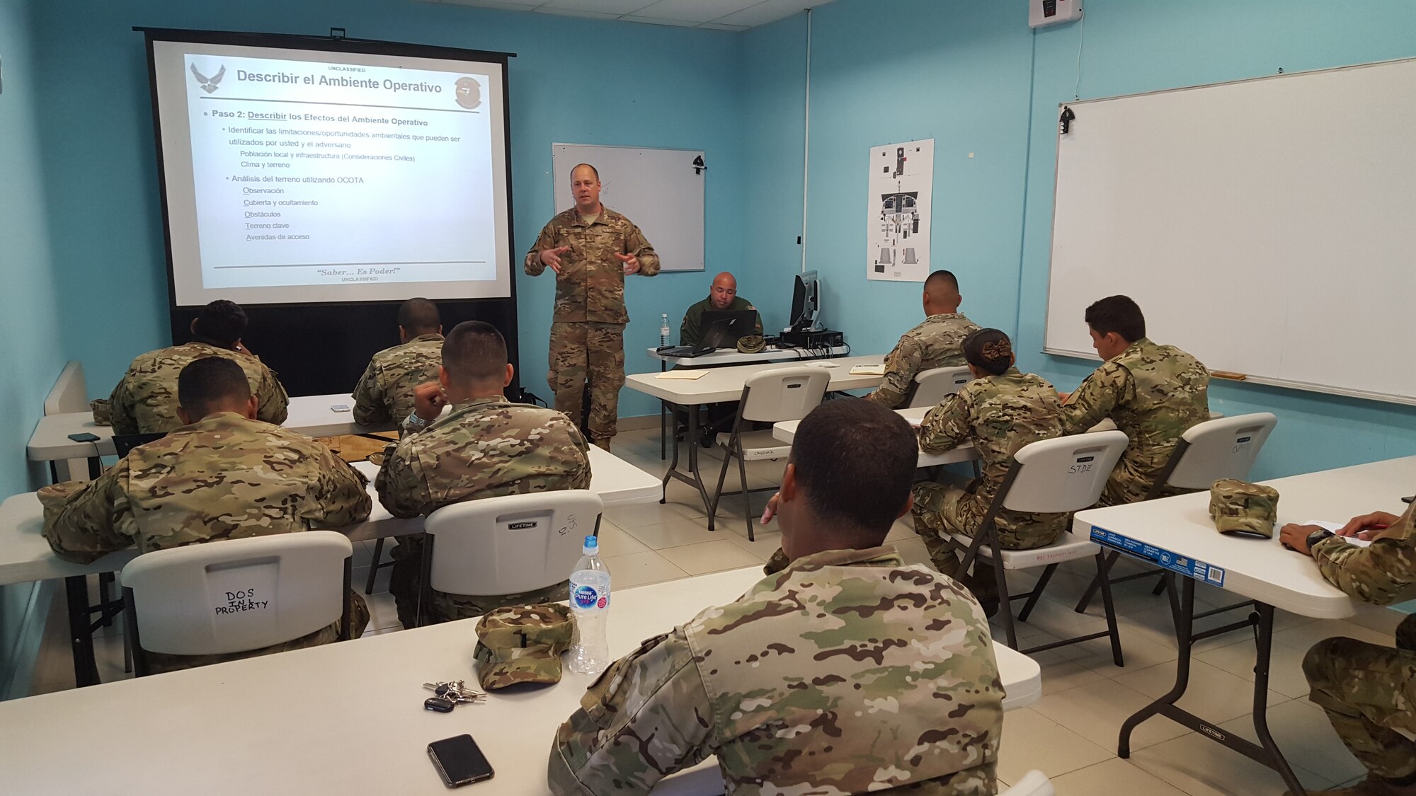Master Sgt. Christopher White, 571st Mobility Support Advisory Squadron air advisor, instructs students from the National Air and Naval Service of Panama, also known as SENAN, on the fundamentals of intelligence operations at Panama Pacificó Air Base, in Panama. Approximately 235 hours of assessments, seminars, and hands-on practicum took place at five bases within the Panama City location, graduating 63 SENAN personnel from multiple duty specialties. (U.S. Air Force Photo by Lt. Col. Christopher Shea)