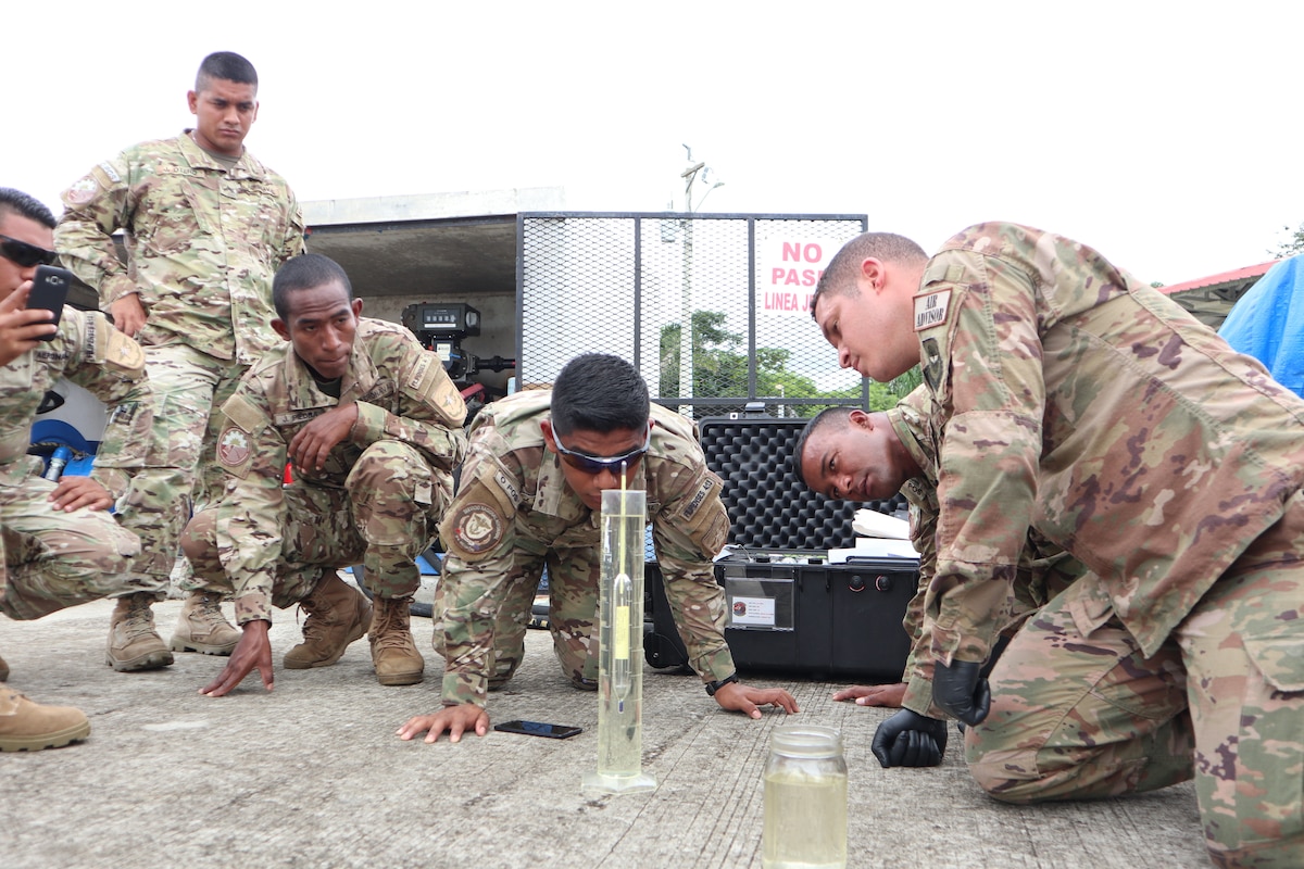 Staff Sgt. Anthony Colon-Matos, 571st Mobility Support Advisory Squadron air advisor, instructs students from the National Air and Naval Service of Panama, also known as SENAN, on proper aircraft fuel quality testing procedures at the forward operating location of Nicanor Air Base in Panama. Approximately 235 hours of assessments, seminars, and hands-on practicum took place at five bases within the Panama City location, graduating 63 SENAN personnel from multiple duty specialties. (U.S. Air Force Photo by Capt. Stephanie Kaari)
