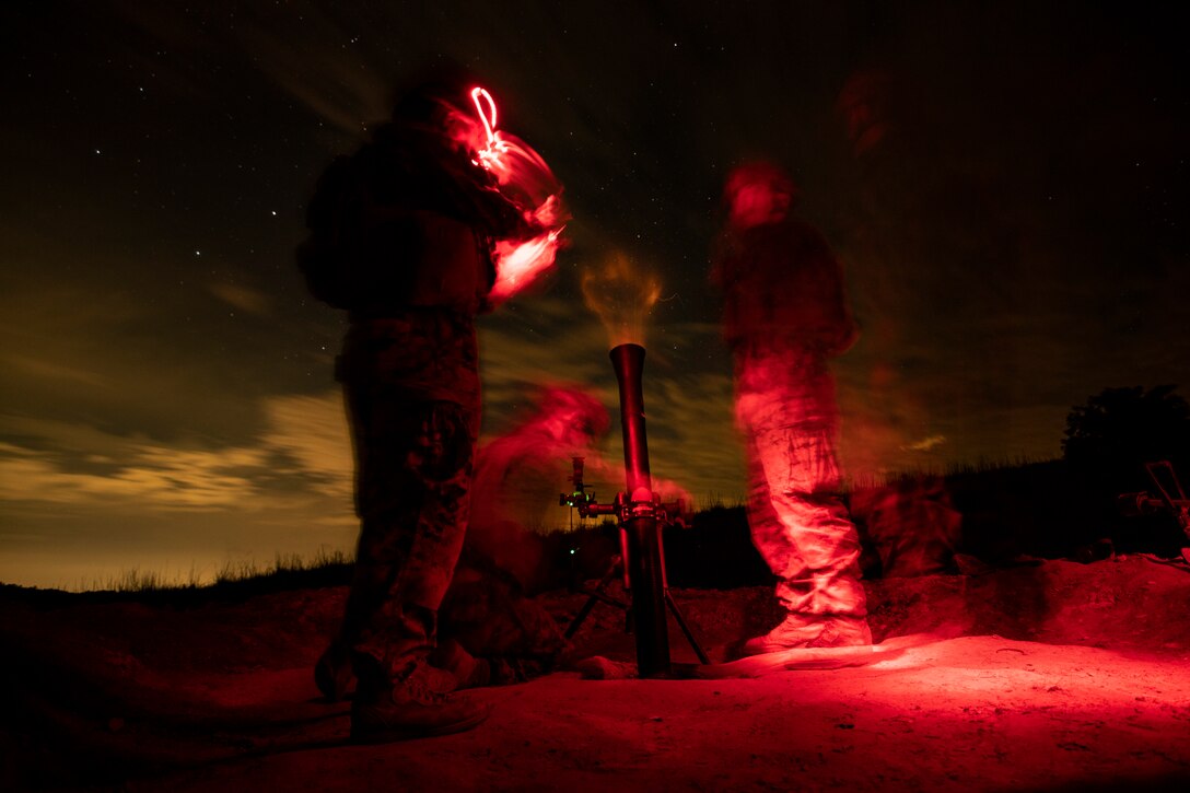 Mortarmen with Battalion Landing Team, 1st Battalion, 2nd Marines, 22nd Marine Expeditionary Unit fire a 81mm mortar system during a range as part of the 22nd MEU Deployment for Training at Fort A.P. Hill, VA., Aug. 1, 2018. The range allowed multiple batteries such as artillery, mortars and fixed-wing aircraft to train together in order to improve internal standard operating procedures in preparation for their upcoming deployment.