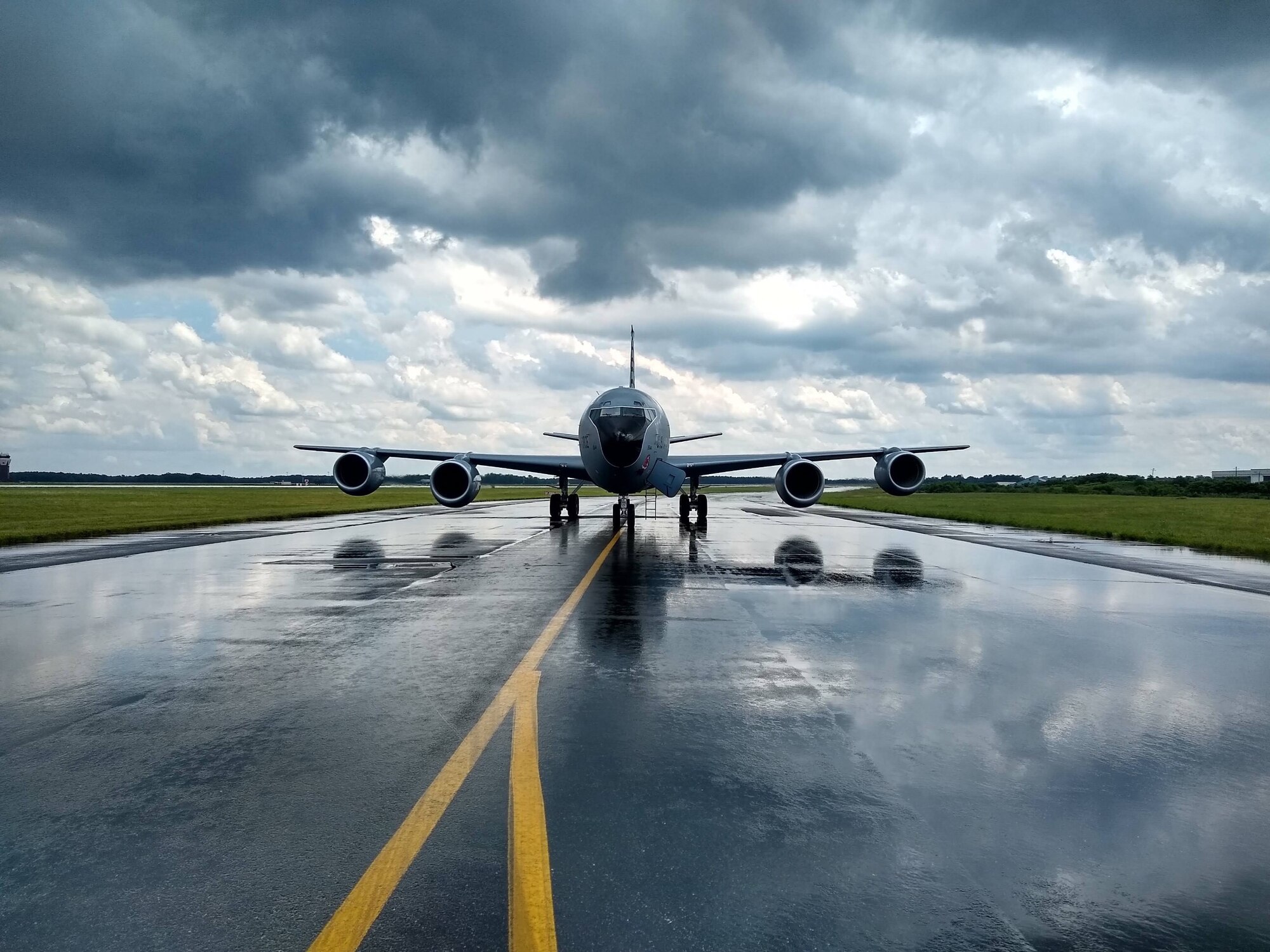 A 108th Wing KC-135R Stratotanker sits on the taxiway at Joint Base McGuire-Dix-Lakehurst, N.J. during a rainstorm during a recent engine running crew change exercise. (U.S. Air National Guard photo by Lt. Col Richard Friendlich)