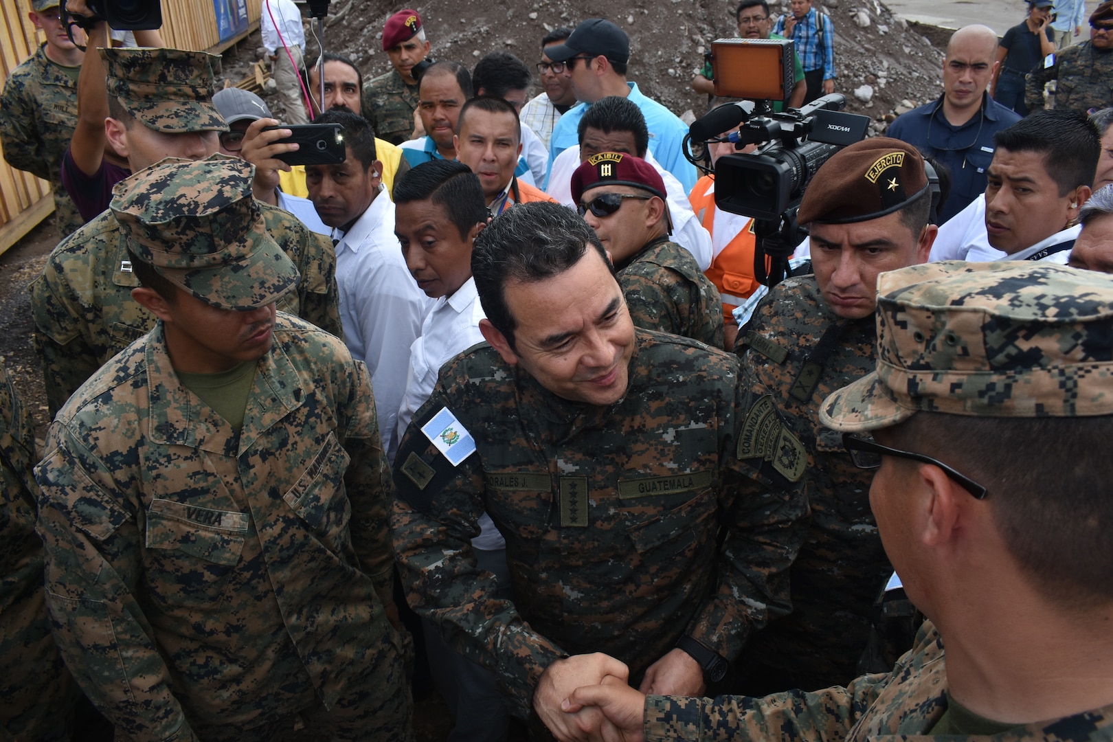 Guatemalan President Jimmy Morales speaks with U.S. Marines.