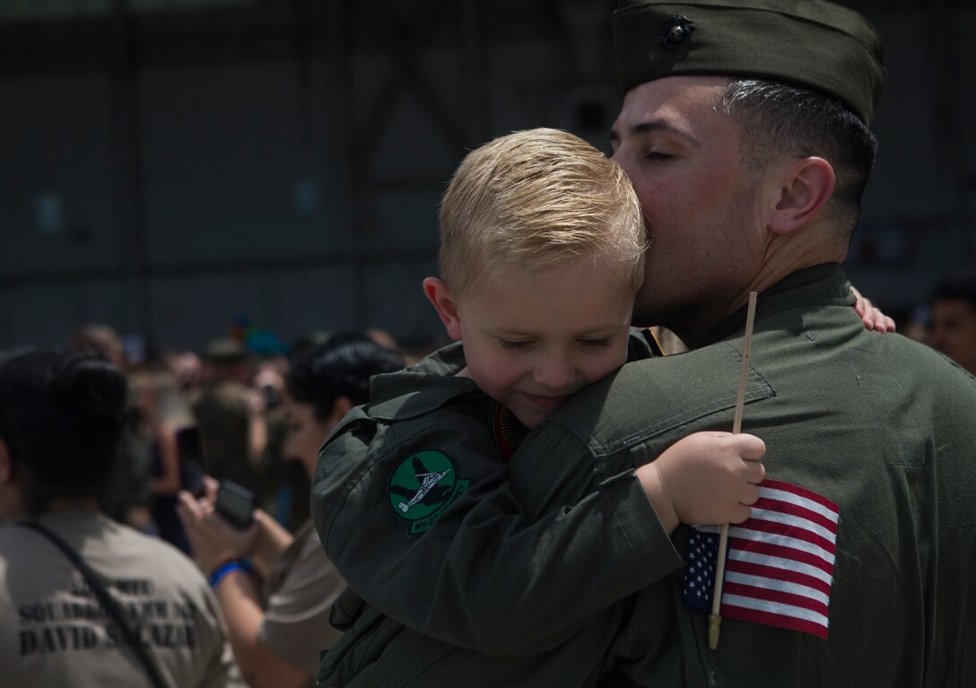 U.S. Marine Corps Capt. Joshua P. Hoppe, with the 26th Marine Expeditionary Unit, embraces his son at Marine Corps Air Station New River, Aug. 5, 2018. Marines with the 26th MEU returned home from a six-month deployment at sea to the U.S. Central, Africa and European Command areas of operation.