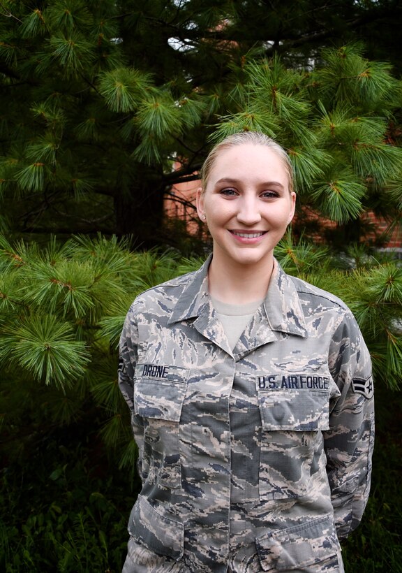 Each month a different Airman is spotlighted within the 932nd Airlift Wing.  This month the commander of the 932nd Airlift Wing, Col. Raymond Smith, presented a special wing coin to Airman First Class Megan Drone, who was spotlighted and told her background story during the pre-Unit Training Assembly meeting on August 3, 2018, at Scott Air Force Base.   Airman Drone is a health service management specialist in the 932d Medical Group's Medical Squadron.  She said, "I enjoy experiencing being in the military part time, while continuing my civilian career and family life, and having control of that balance while meeting so many wonderful people."  (U.S. Air Force photo by Lt. Col. Stan Paregien