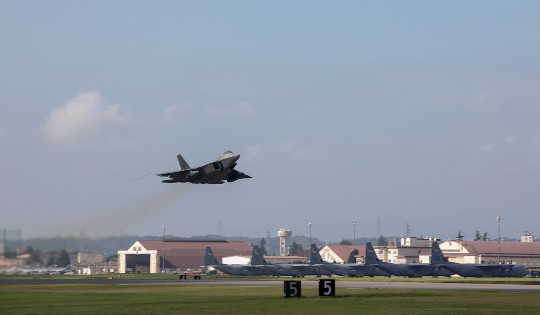An F-22 Raptor from Joint Base Elmendorf-Richardson, Alaska takes off at Yokota Air Base