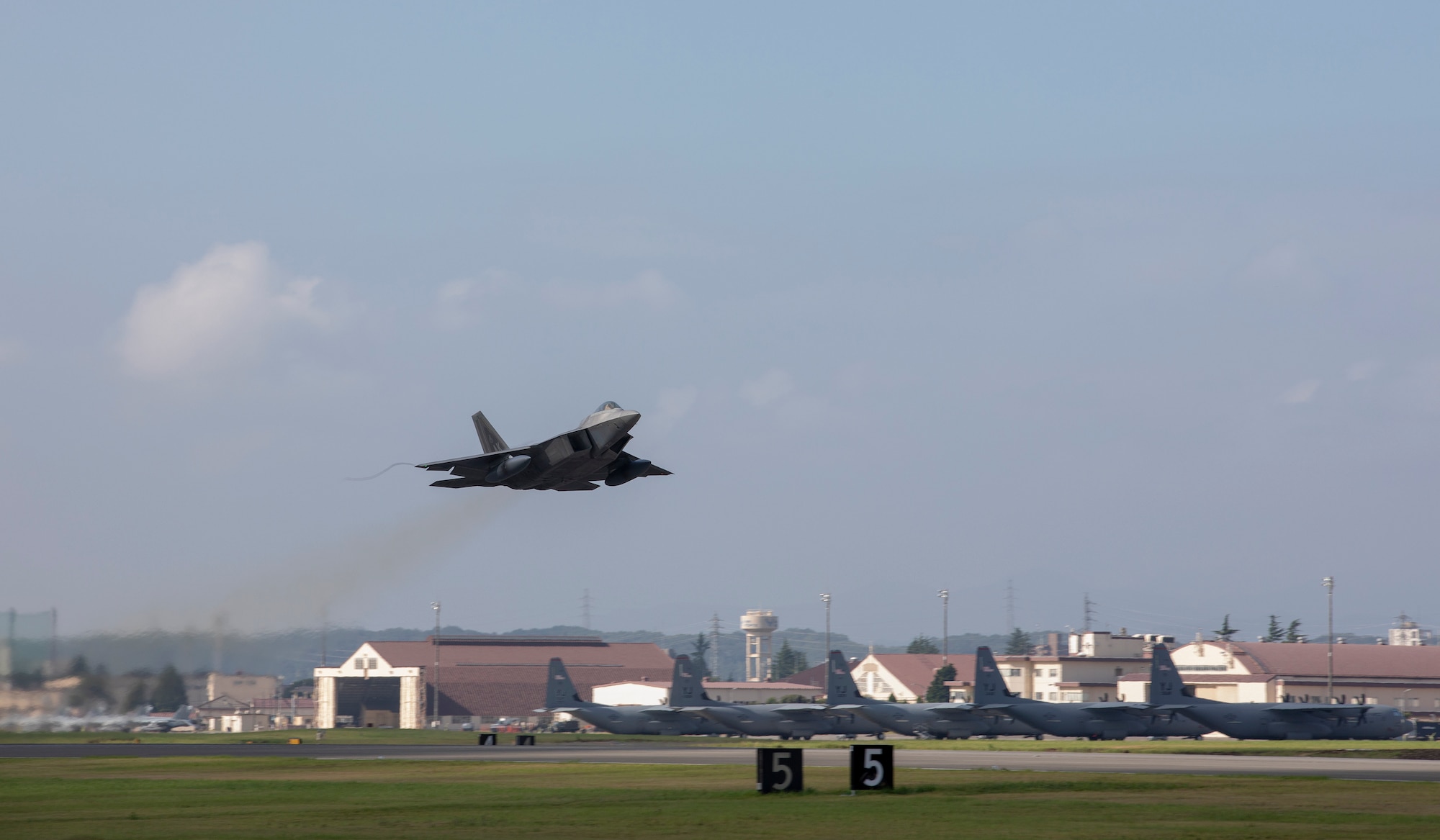 An F-22 Raptor from Joint Base Elmendorf-Richardson, Alaska takes off at Yokota Air Base