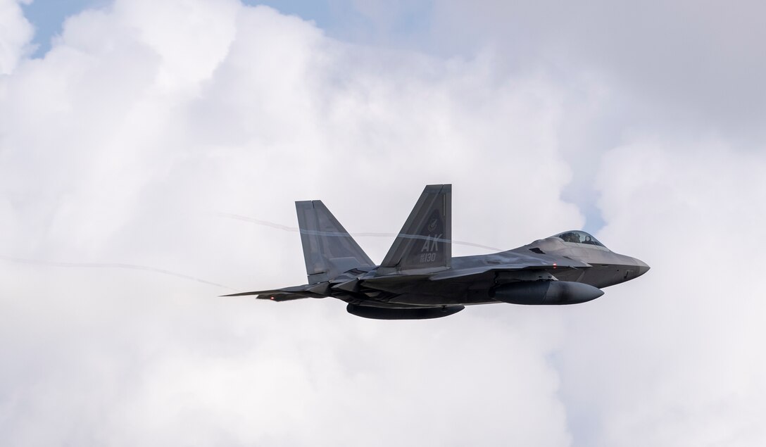An F-22 Raptor from Joint Base Elmendorf-Richardson, Alaska takes off at Yokota Air Base