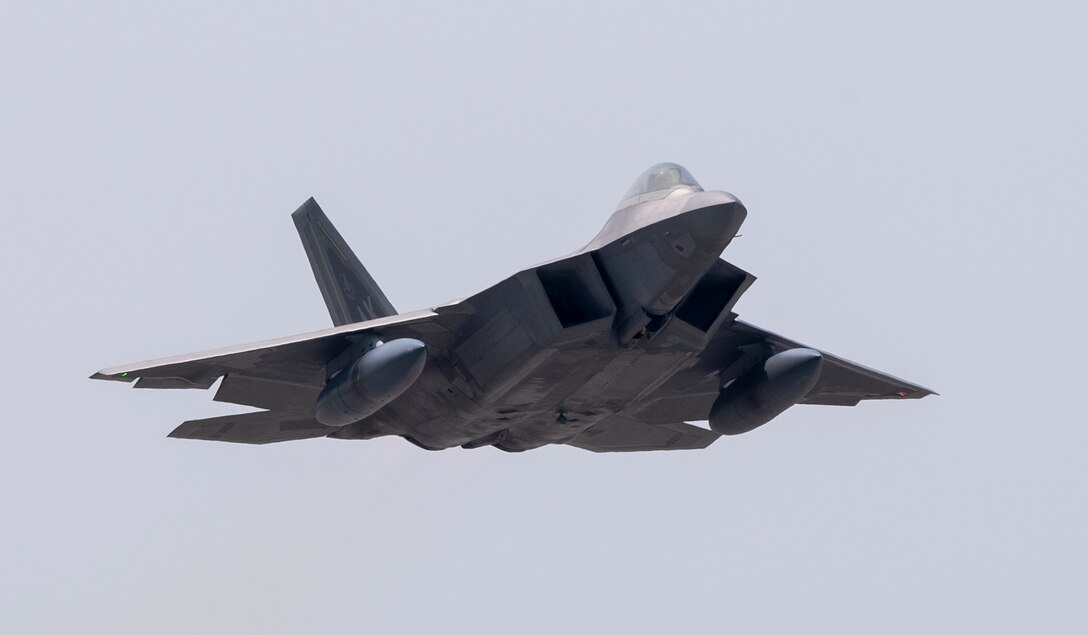 An F-22 Raptor from Joint Base Elmendorf-Richardson, Alaska takes off at Yokota Air Base