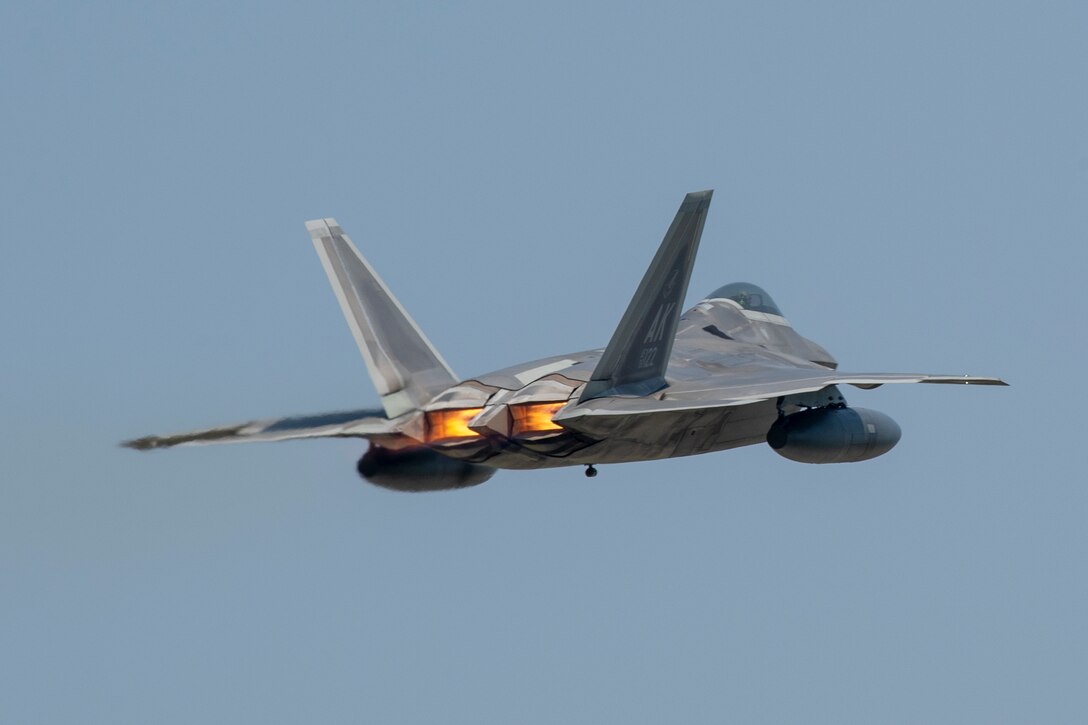 An F-22 Raptor from Joint Base Elmendorf-Richardson, Alaska takes off at Yokota Air Base