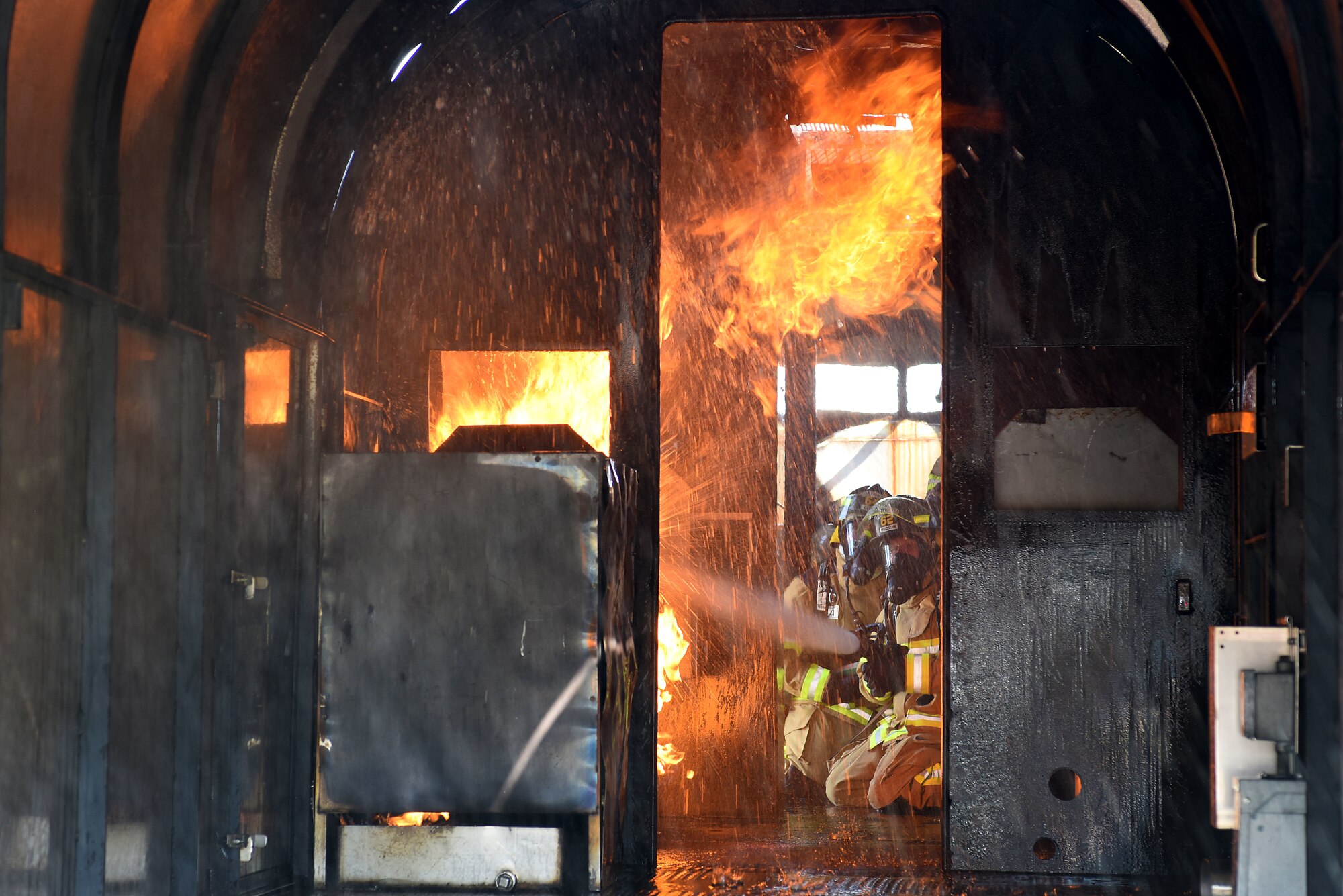 U.S. Air Force Chief Master Sgt. Philip Hudson, 51st Fighter Wing command chief, puts out a simulated aircraft fire during an immersion tour with the 51st Civil Engineer Squadron Fire and Emergency Services flight at Osan Air Base, Republic of Korea, Aug. 3, 2018. Leadership received the opportunity to try their hand at fighting both aircraft and structural fires. (U.S. Air Force photo by Senior Airman Kelsey Tucker)