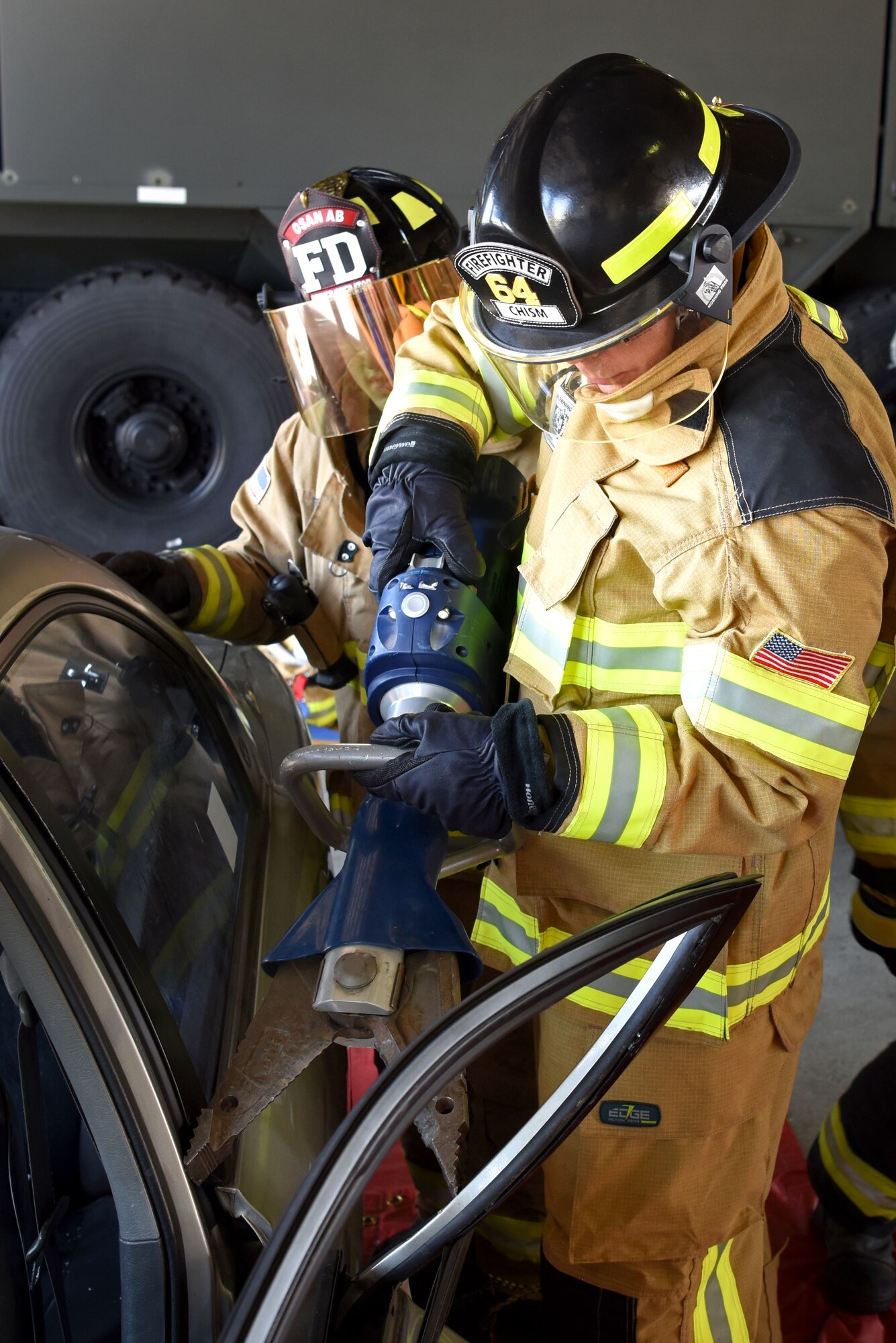 U.S. Air Force Chief Master Sgt. Franklin Chism, 51st Mission Support Group superintendent, learns how to use Jaws of Life during an immersion tour with the 51st Civil Engineer Squadron Fire and Emergency Services flight at Osan Air Base, Republic of Korea, Aug. 3, 2018. Jaws of Life are used to pry open vehicles to free those trapped within. (U.S. Air Force photo by Senior Airman Kelsey Tucker)