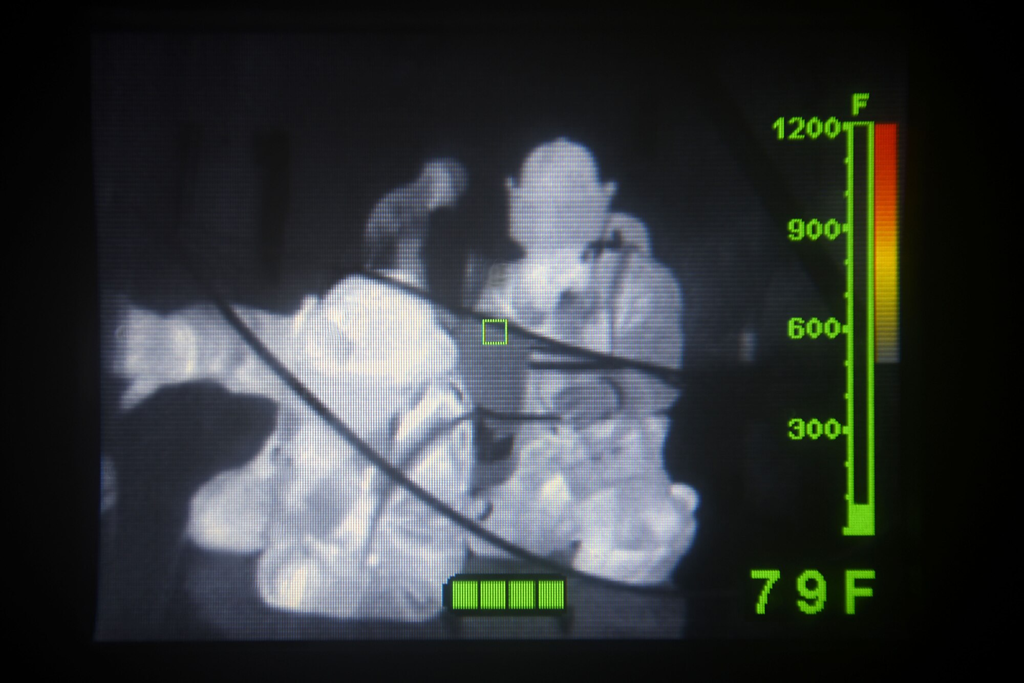 Leadership from the 51st Fighter Wing searches a pitch-black room by touch during an immersion tour with the 51st Civil Engineer Squadron Fire and Emergency Services flight at Osan Air Base, Republic of Korea, Aug. 3, 2018. The room was filled with fog and ropes to make the task more difficult, simulating what firefighters may face in a real-world situation. (U.S. Air Force photo by Senior Airman Kelsey Tucker)