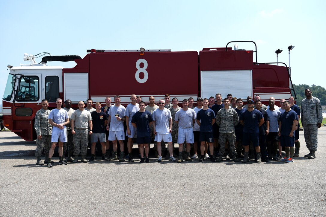 U.S. Airmen assigned to the 51st Civil Engineer Squadron Fire and Emergency Services flight, along with 51st Fighter Wing leadership, pose for a group photo after an immersion tour at Osan Air Base, Republic of Korea, Aug. 3, 2018. Wing leadership ended the day with a greater respect for the difficulties faced by the firefighters in their varied duties. (U.S. Air Force photo by Senior Airman Kelsey Tucker)