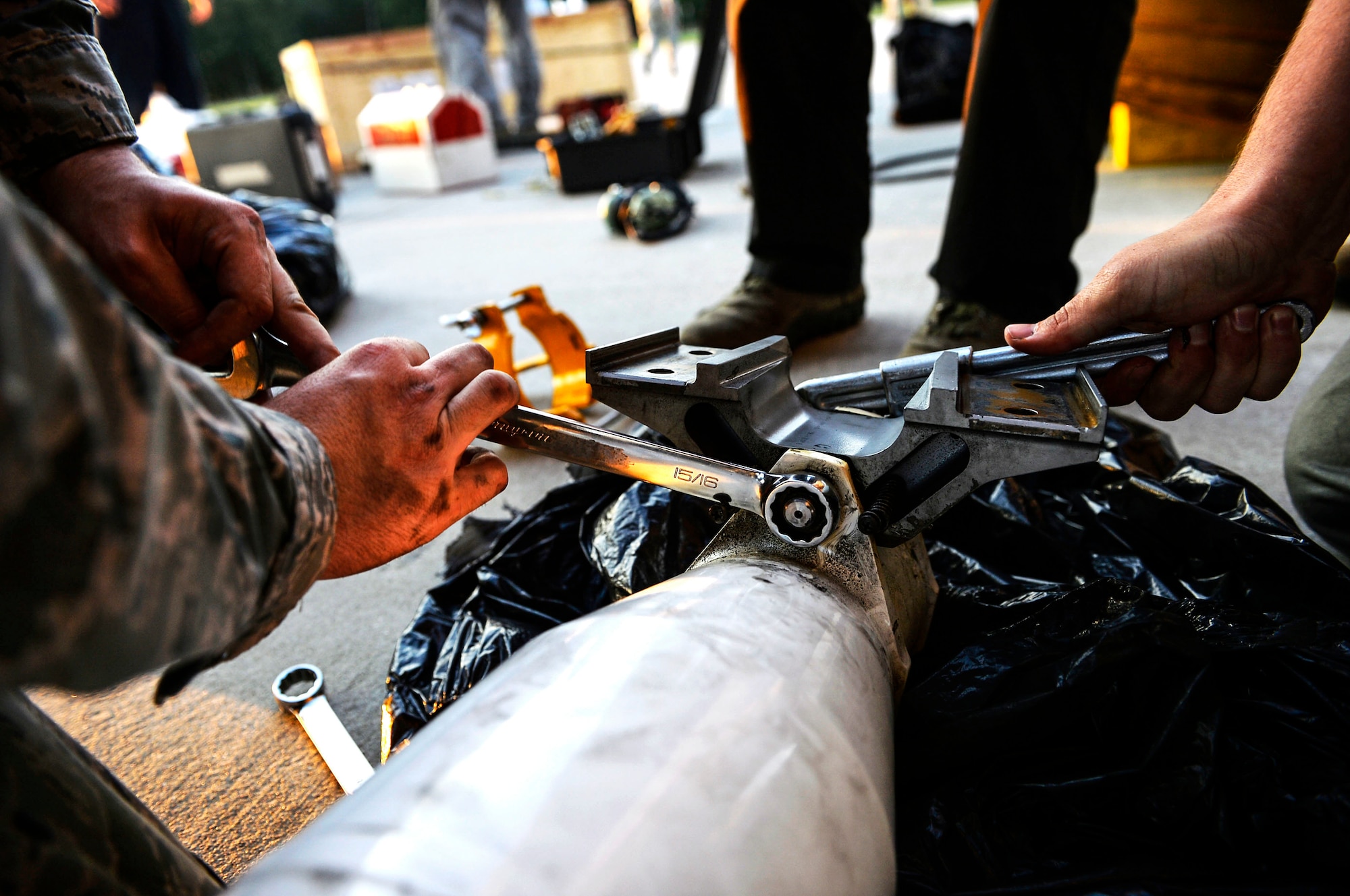 U.S. Airmen assigned to the 86th Aircraft Maintenance Squadron secure bolts on the strut of a C-130J Super Hercules on Powidz Air Base, Poland, Aug. 3, 2018. Maintenance Airmen are responsible for ensuring the operational and structural integrity of aircraft. (U.S. Air Force photo by Senior Airman Joshua Magbanua)