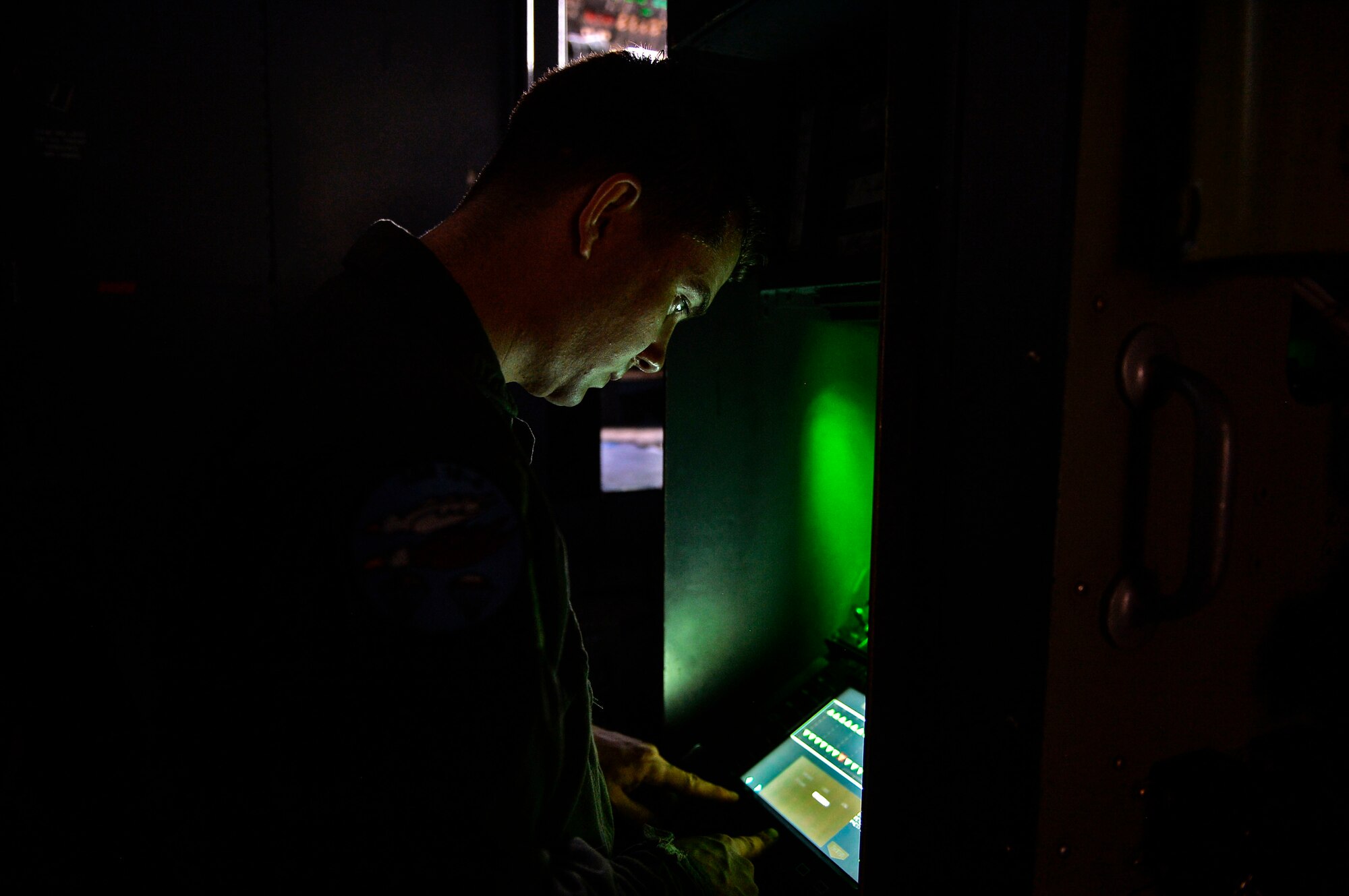 U.S. Air Force Airman 1st Class Christopher Carmody, 37th Airlift Squadron C-130J Super Hercules loadmaster, conducts pre-takeoff procedures for his aircraft at Powidz Air Base, Aug. 2, 2018. Loadmasters are responsible for ensuring the safety and security of cargo, troops, and passengers during flight. (U.S. Air Force photo by Senior Airman Joshua Magbanua)