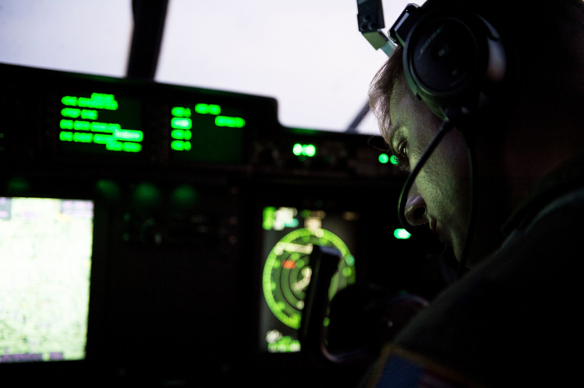 U.S. Air Force Capt. Pete Wolber, 37th Airlift Squadron C-130J Super Hercules pilot, operates the control panel of his aircraft during a training flight over Poland Aug. 2, 2018. Aircraft and Airmen from the 86th Airlift Wing have been conducting aviation detachment rotations since 2012. (U.S. Air Force photo by Senior Airman Joshua Magbanua)