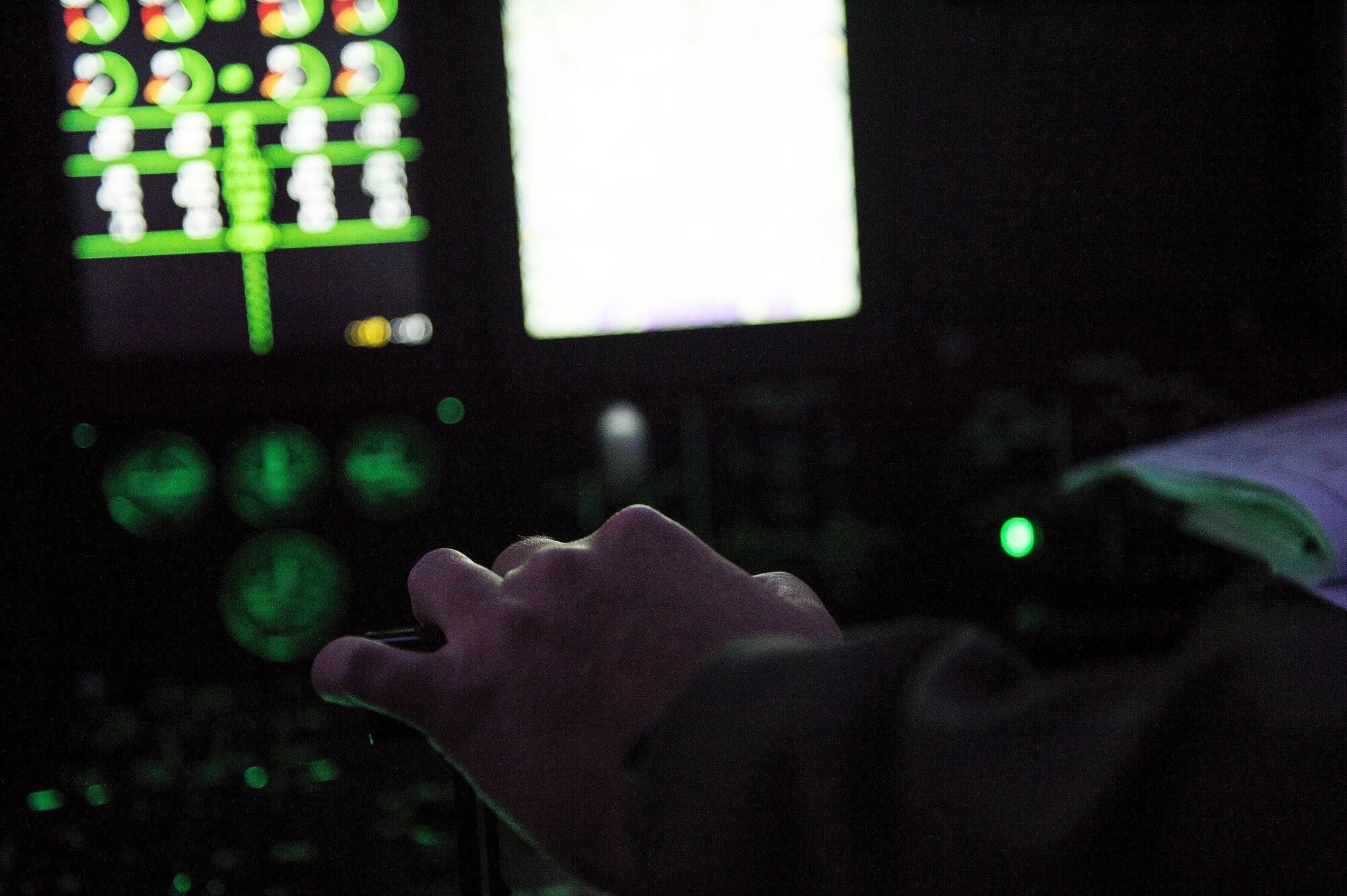 U.S. Air Force Capt. Pete Wolber, 37th Airlift Squadron C-130J Super Hercules pilot, operates the controls of his aircraft during a training mission over Poland, Aug. 2, 2018. U.S. C-130J pilots train to conduct various maneuvers such as tactical evasions, assault landings, and combat airdrops. (U.S. Air Force photo by Senior Airman Joshua Magbanua)