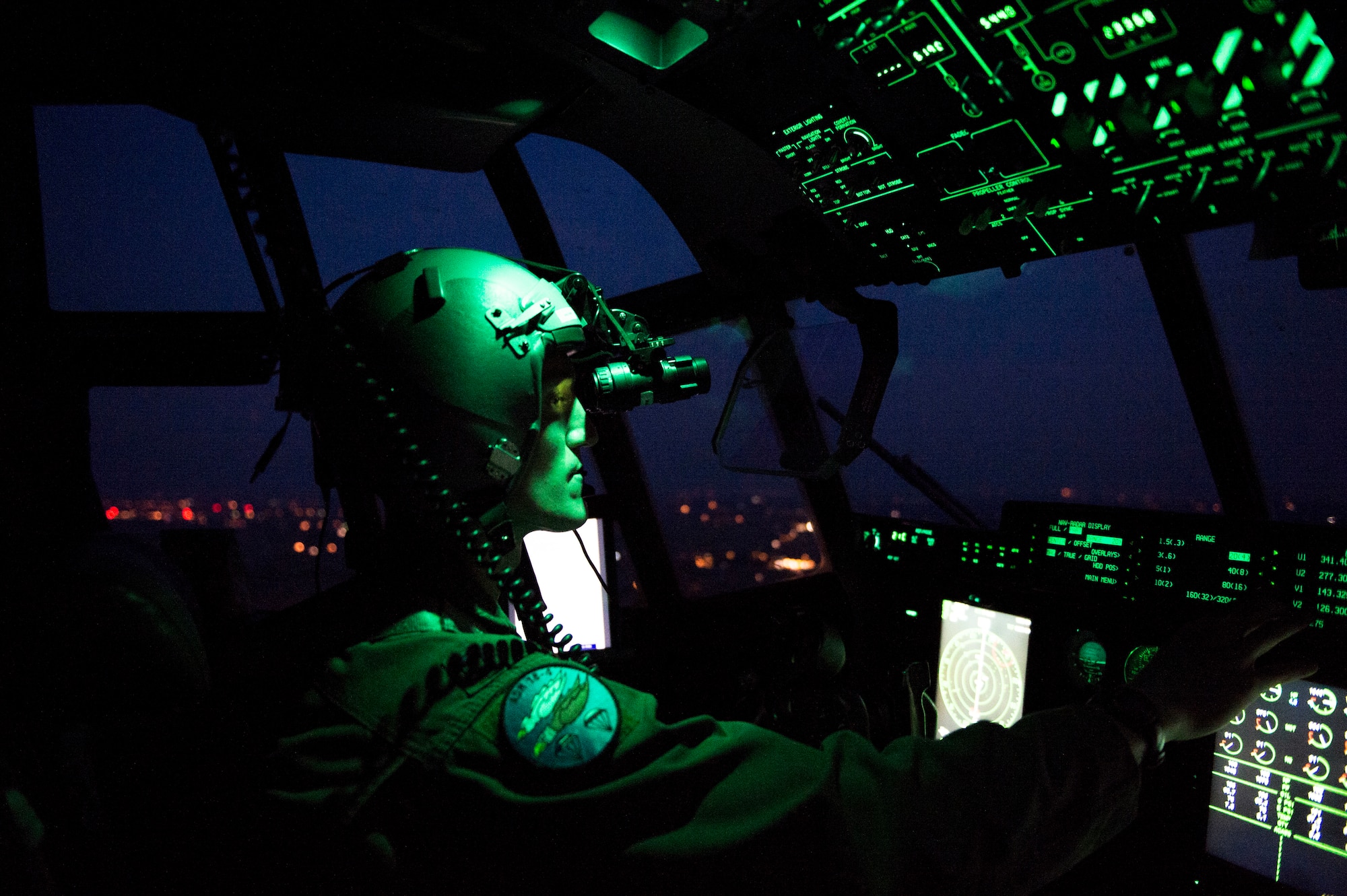 U.S. Air Force Capt. Leland Quinter, 37th Airlift Squadron C-130J Super Hercules pilot, wears night vision goggles during a training flight over Poland Aug. 2, 2018. U.S. C-130J pilots train to fly in multiple complex scenarios in various atmospheric conditions. (U.S. Air Force photo by Senior Airman Joshua Magbanua)