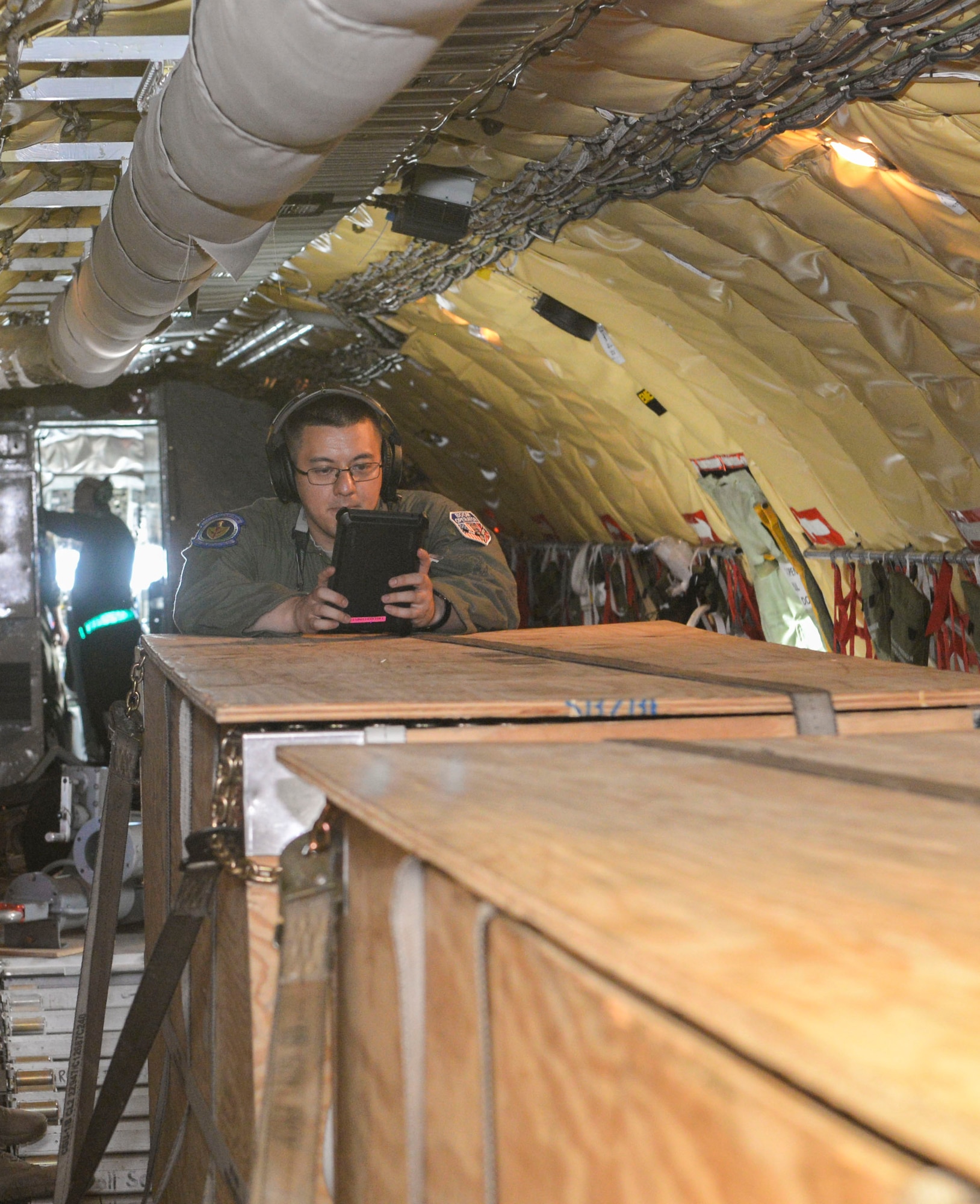 U.S. Air Force Senior Airman Jordan Barker, 351st Air Refueling S	quadron boom operator, checks his pre-flight checklist aboard a KC-135 Stratotanker at RAF Mildenhall, England, July 30, 2018. U.S. Air Force Airmen and F-15C/D Eagles from the 48th Fighter Wing, RAF Lakenheath, England, deployed to Keflavik Air Base, Iceland, to conduct an Icelandic Air Surveillance rotation in support of NATO commitments.  (U.S. Air Force photo by Airman 1st Class Alexandria Lee)