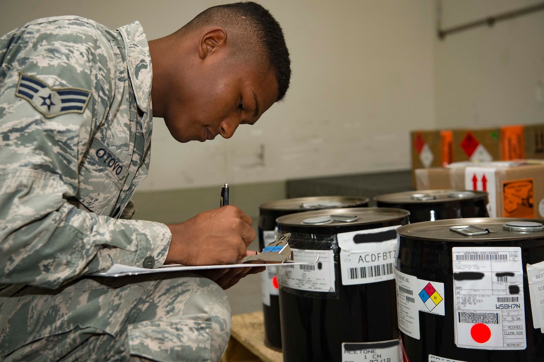 U.S. Air Force Senior Airman Erumena Otovo Jr., 721st Aerial Port Squadron Special Handling specialist, inspects hazardous cargo on Ramstein Air Base, Germany, July 18, 2018. The 721st APS is composed of multiple sections and over 500 Airmen who work together to support Air Mobility Command's mission by ensuring Ramstein's cargo and passengers reach their destination safely. (U.S. Air Force photo by Senior Airman Elizabeth Baker)