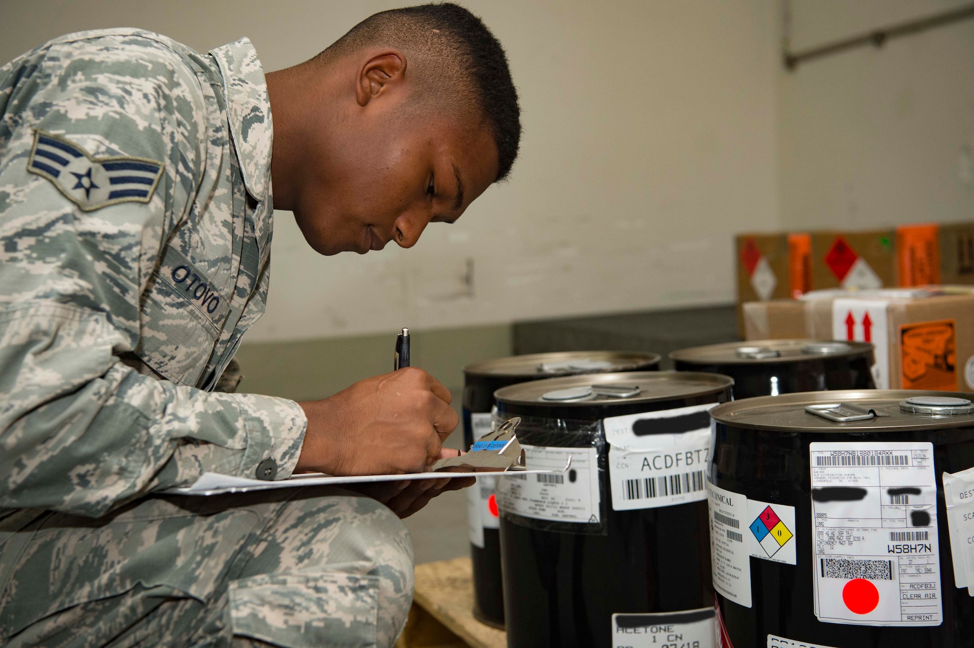 U.S. Air Force Senior Airman Erumena Otovo Jr., 721st Aerial Port Squadron Special Handling specialist, inspects hazardous cargo on Ramstein Air Base, Germany, July 18, 2018. The 721st APS is composed of multiple sections and over 500 Airmen who work together to support Air Mobility Command's mission by ensuring Ramstein's cargo and passengers reach their destination safely. (U.S. Air Force photo by Senior Airman Elizabeth Baker)