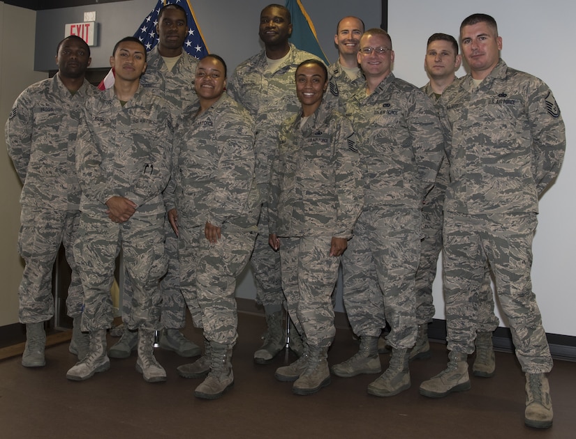 Airmen with the 87th Logistics Readiness Squadron pose during the U.S. Army NCO Academy master leadership course graduation on Joint Base McGuire-Dix-Lakehurst, N.J., July 20, 2018. The Airmen attended the Army graduation to support U.S. Air Force Master Sgt. Valentino Thorne, 87th LRS superintendent of squadron readiness, who was the first Airman on Joint Base MDL to graduate from a sister service's senior NCO academy. (U.S. Air Force photo by Airman Ariel Owings)