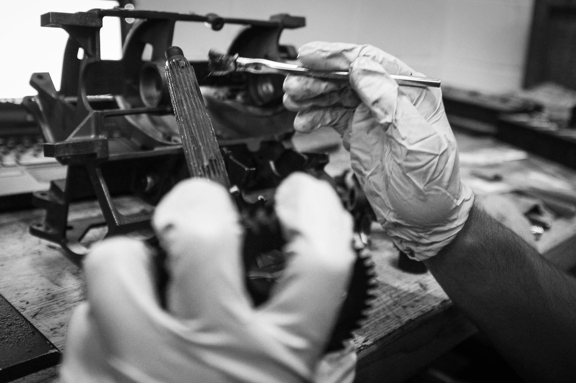 An Airman assigned to the 20th Equipment Maintenance Squadron armament maintenance flight applies lubricant to an M61A1 Vulcan 20 mm rotary cannon part at Shaw Air Force Base, S.C., Aug. 2, 2018.