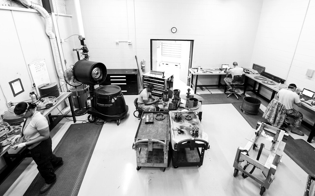 U.S. Airmen assigned to the 20th Equipment Maintenance Squadron armament flight perform inspections on numerous M61A1 Vulcan 20 mm rotary cannon parts at Shaw Air Force Base, S.C., Aug. 2, 2018.