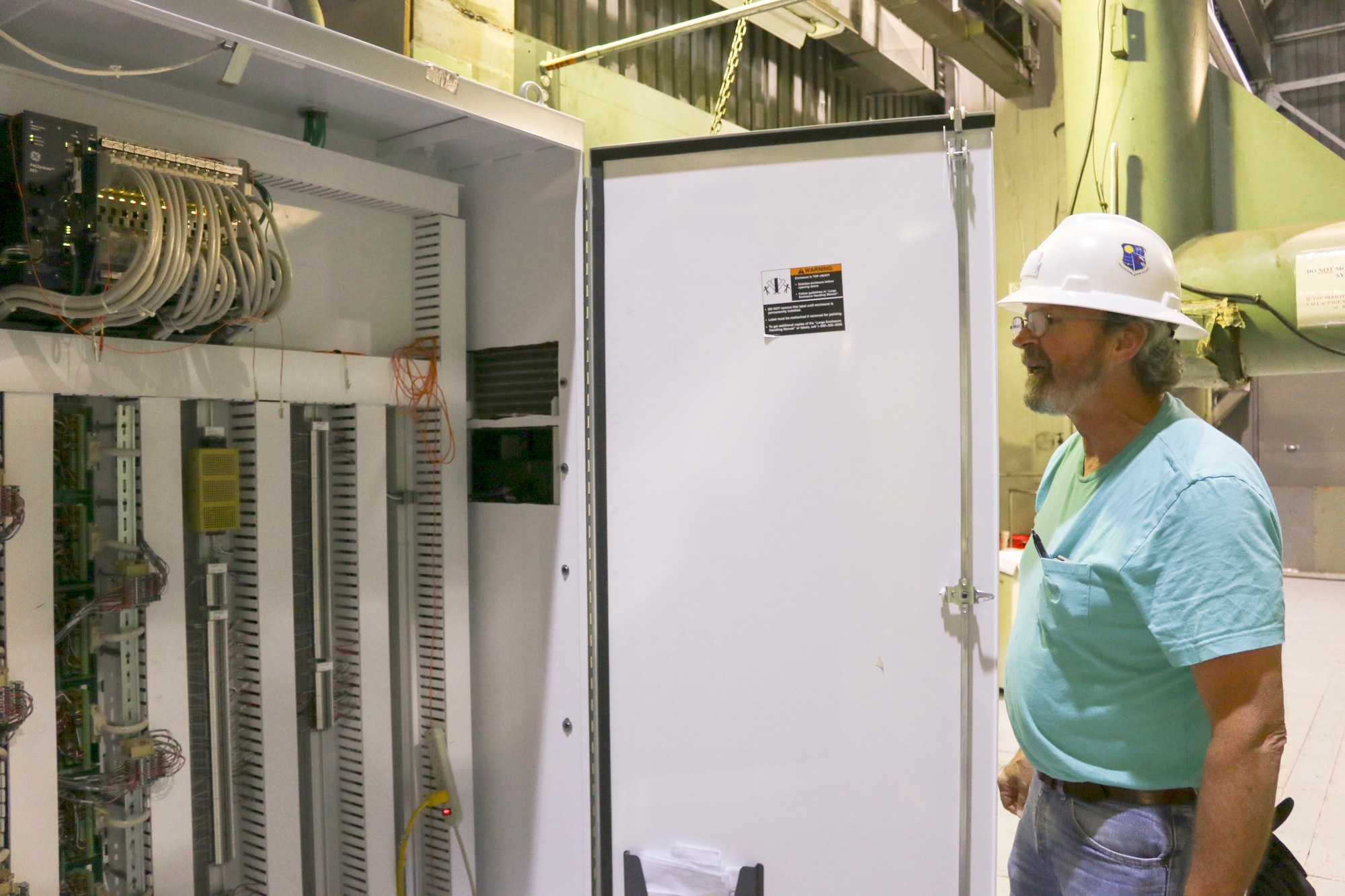 Teddy Beddingfield, an instrumentation technician for the von Kármán Facility at Arnold Air Force Base, checks one of the data panels in Wind Tunnel A. (U.S. Air Force photo by Deidre Ortiz)