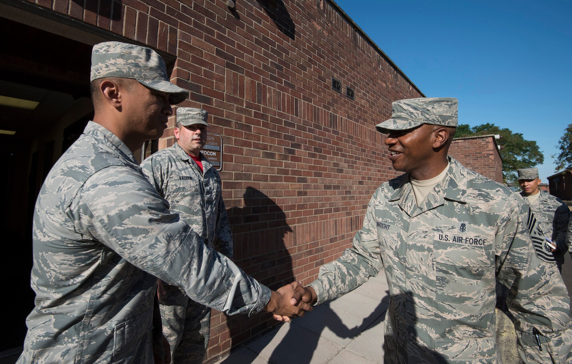 U.S. Air Force 2nd Lieutenant Ymir Fulton Eboras (left), with the 423rd Communications Sq., greets Chief Master Sgt. of the Air Force (right), Kaleth O. Wright, during a base visit on Aug. 3, 2018 at RAF Alconbury, United Kingdom. The purpose of his visit was to meet with U.S. Air Force Airmen, speak about some current Air Force topics and learn more about the 501st CSW mission. (U.S. Air Force photo by TSgt. Brian Kimball)